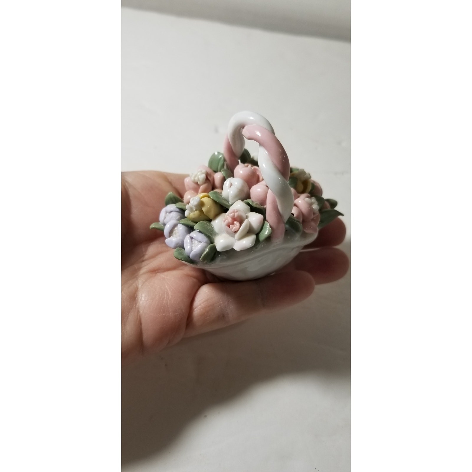 Three inch by 3 inch hand painted porcelain basket (1.1282)