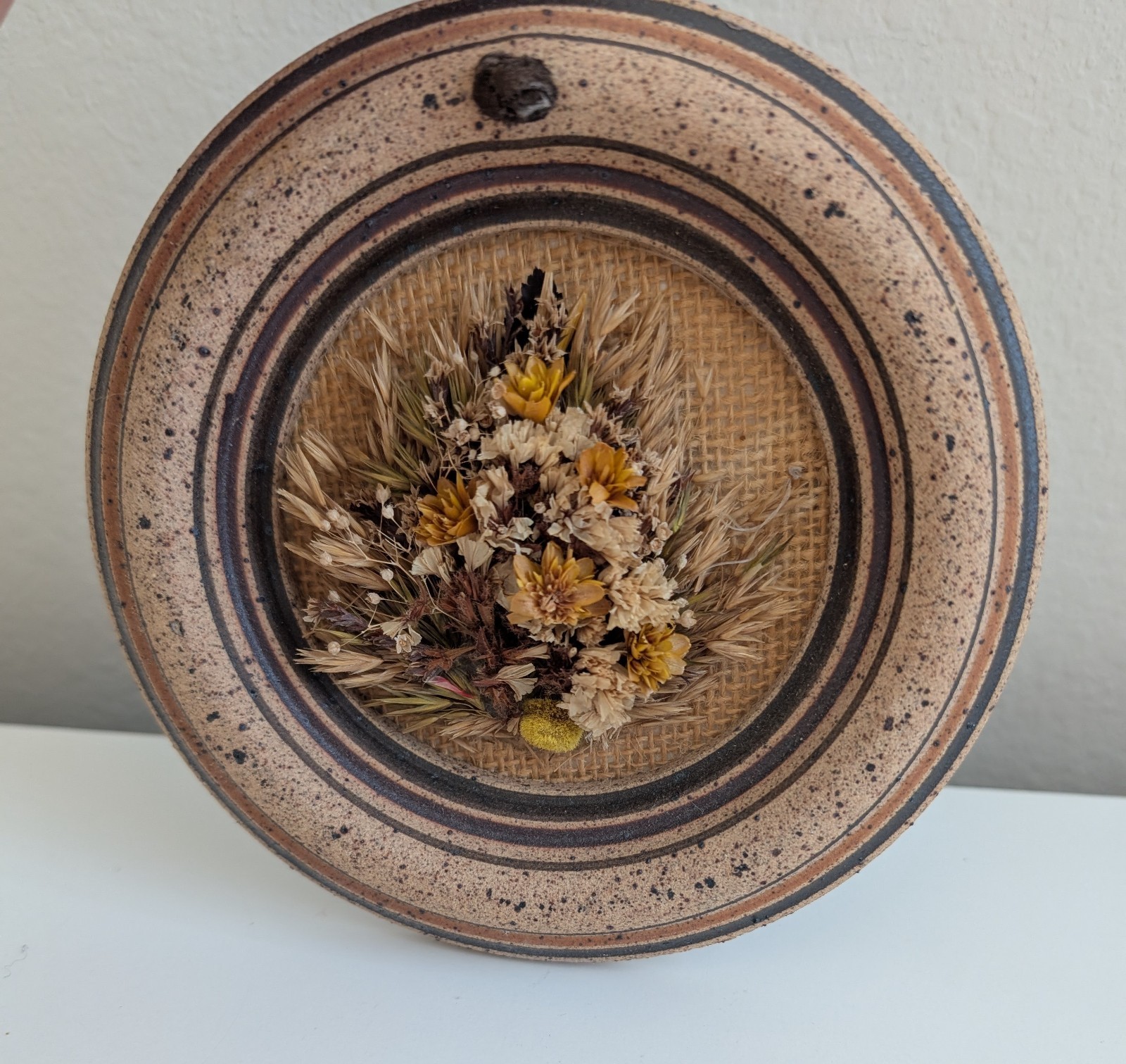 Dried flowers wall hanging round pottery circle speckled floral art boho fall