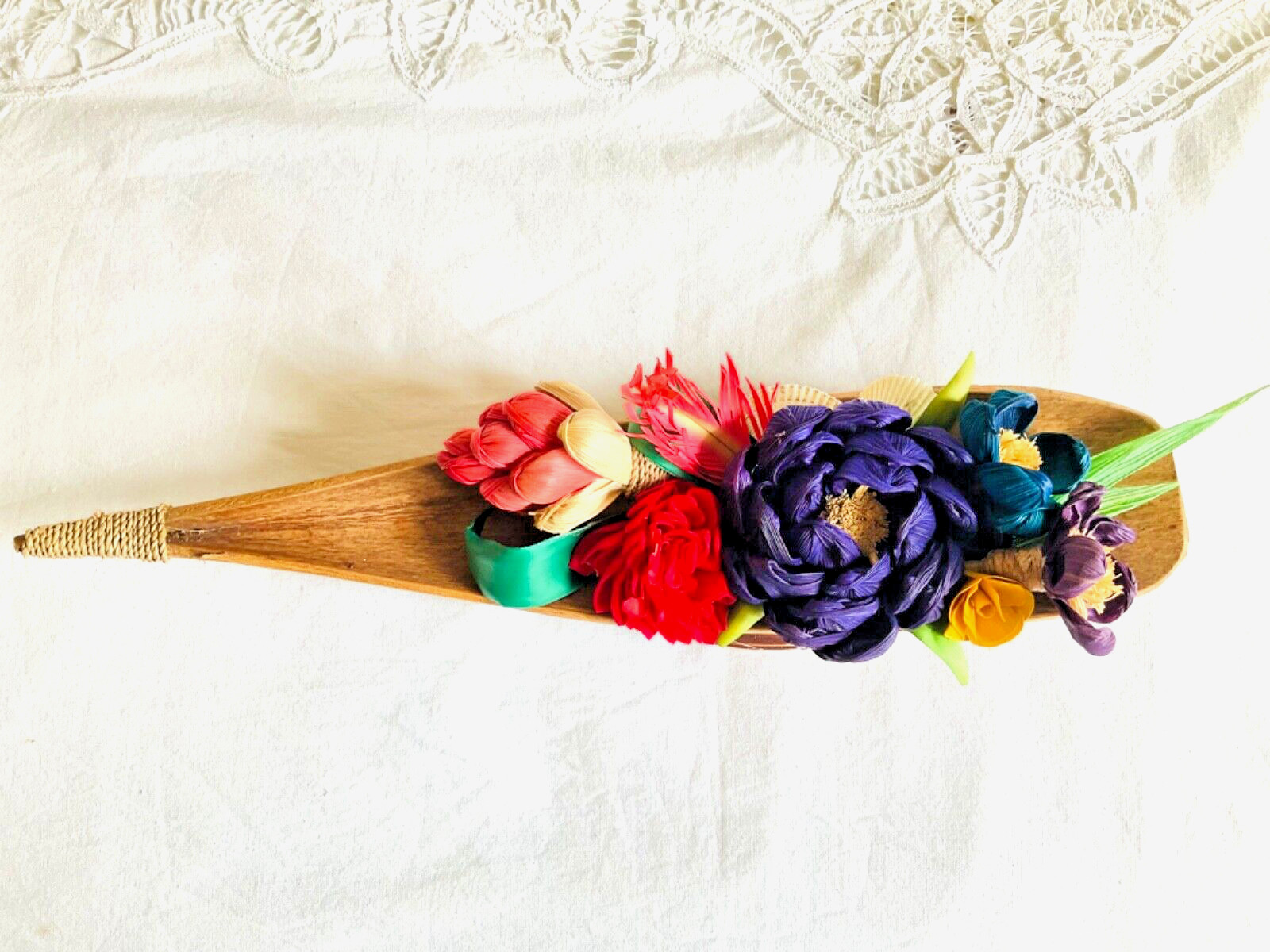 flower arrangements. Coconut spathe vase, dried corn husks, naturals.