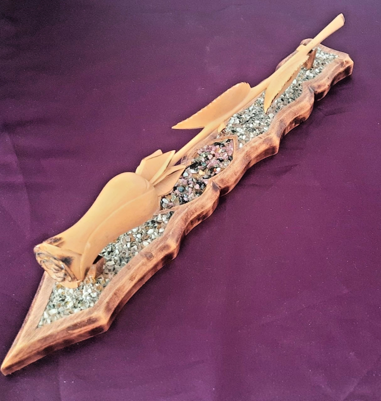 natural wood rose on a stand with hand-carved stones.