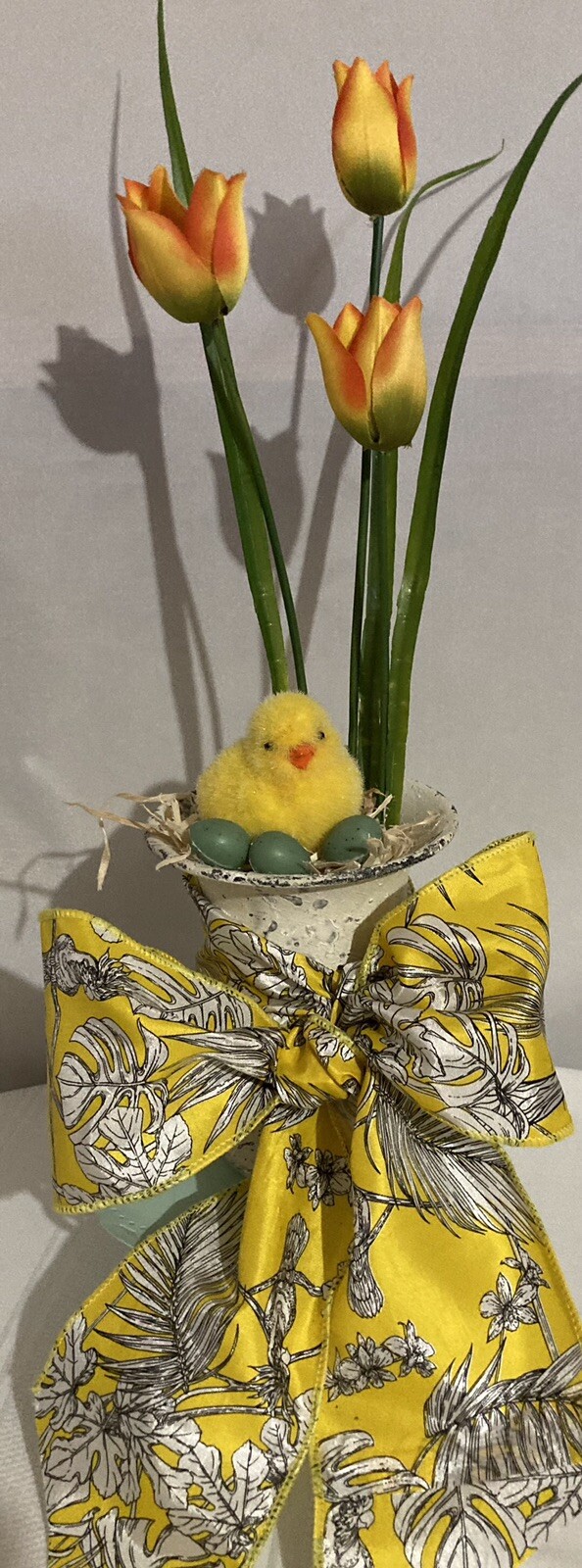 Cute Little Yellow Chick With Eggs In An Urn
