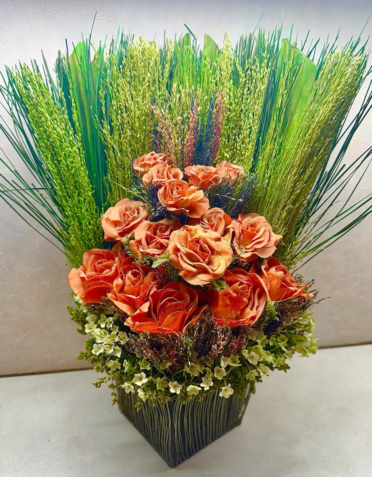 Orange Roses & Green Reeds MSM Modern Floral Arrangement In Wire Basket 16”
