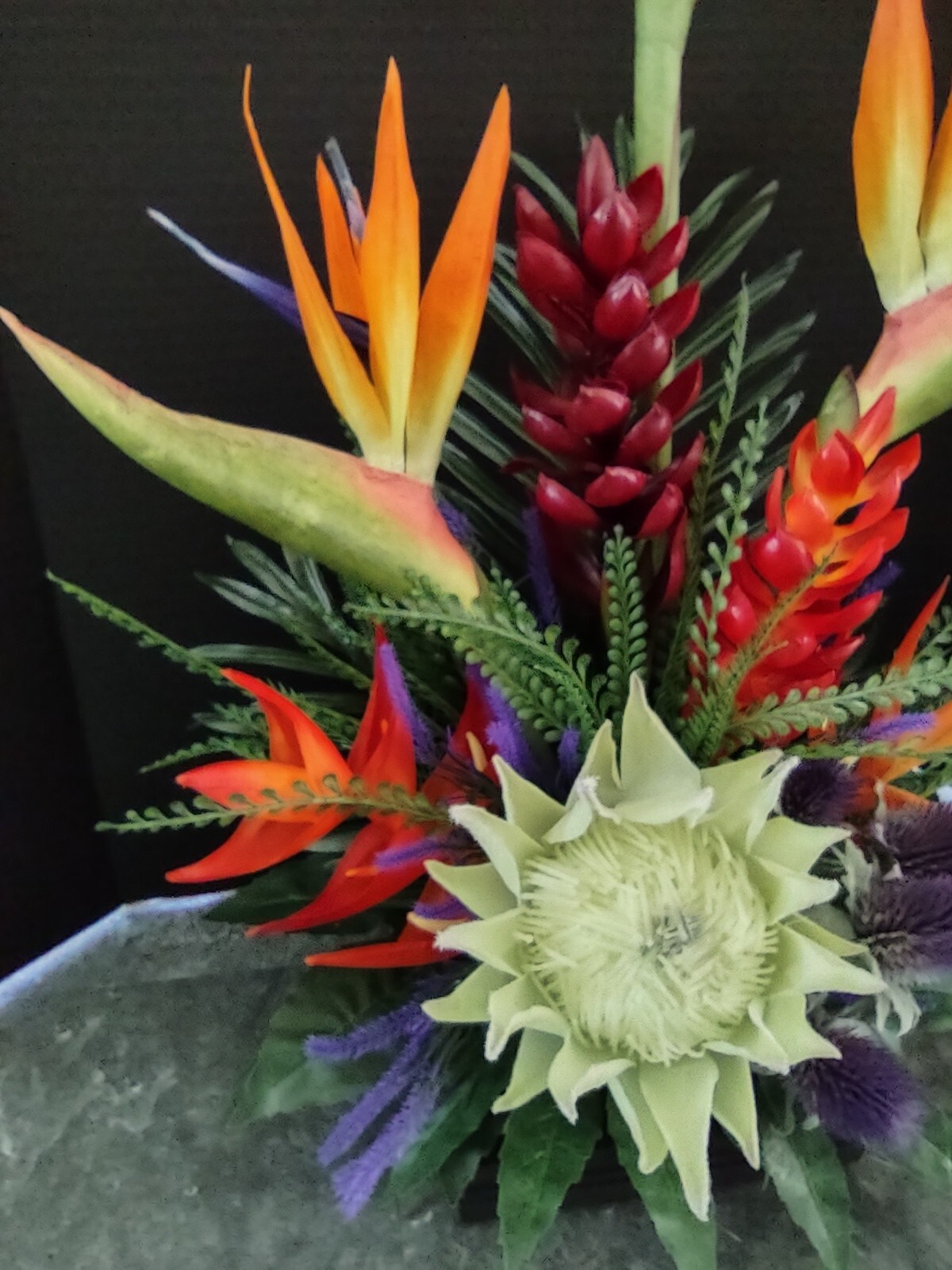 Artificia ltropical floral arrangement