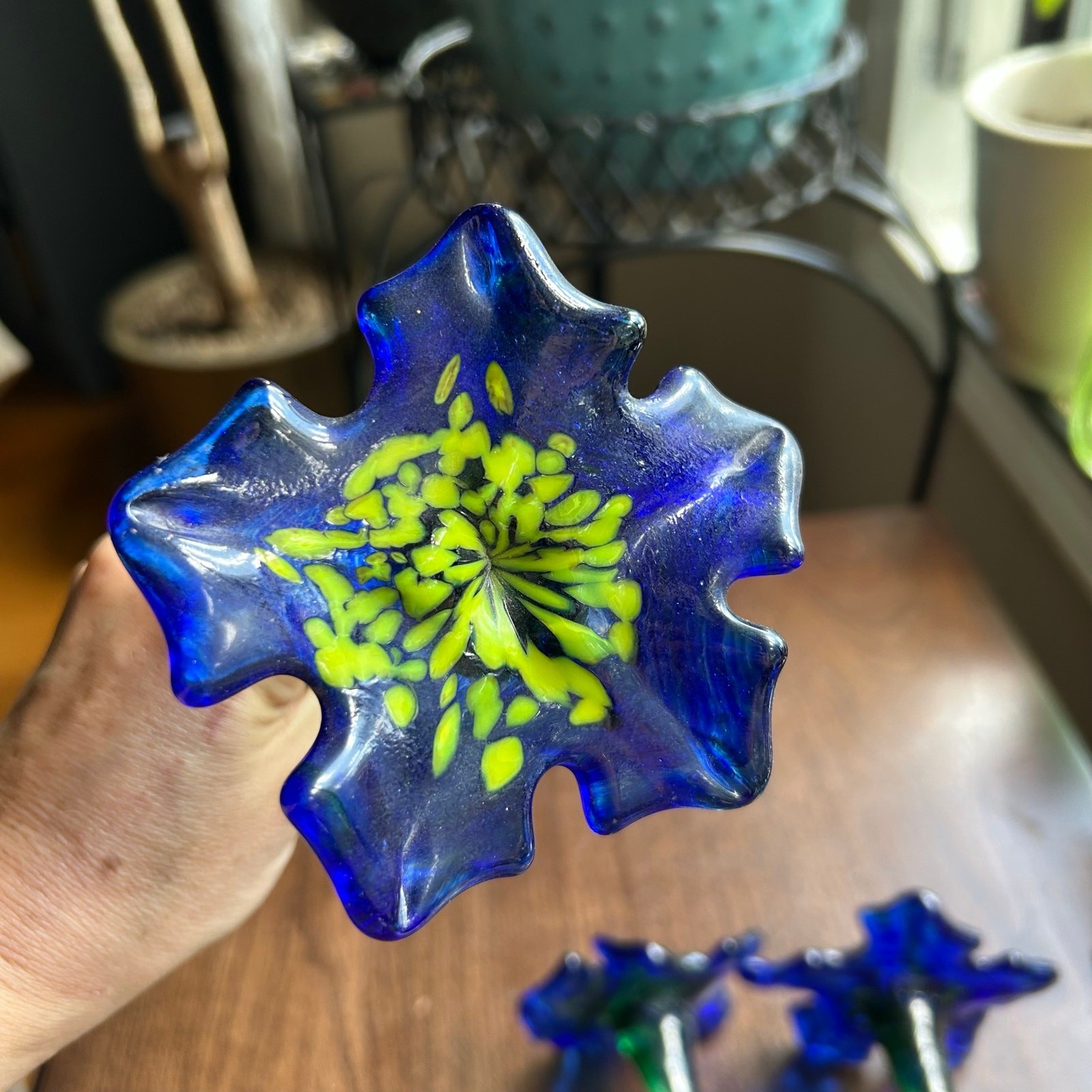 Handcrafted blue and yellow glass flower sculptures long green stems