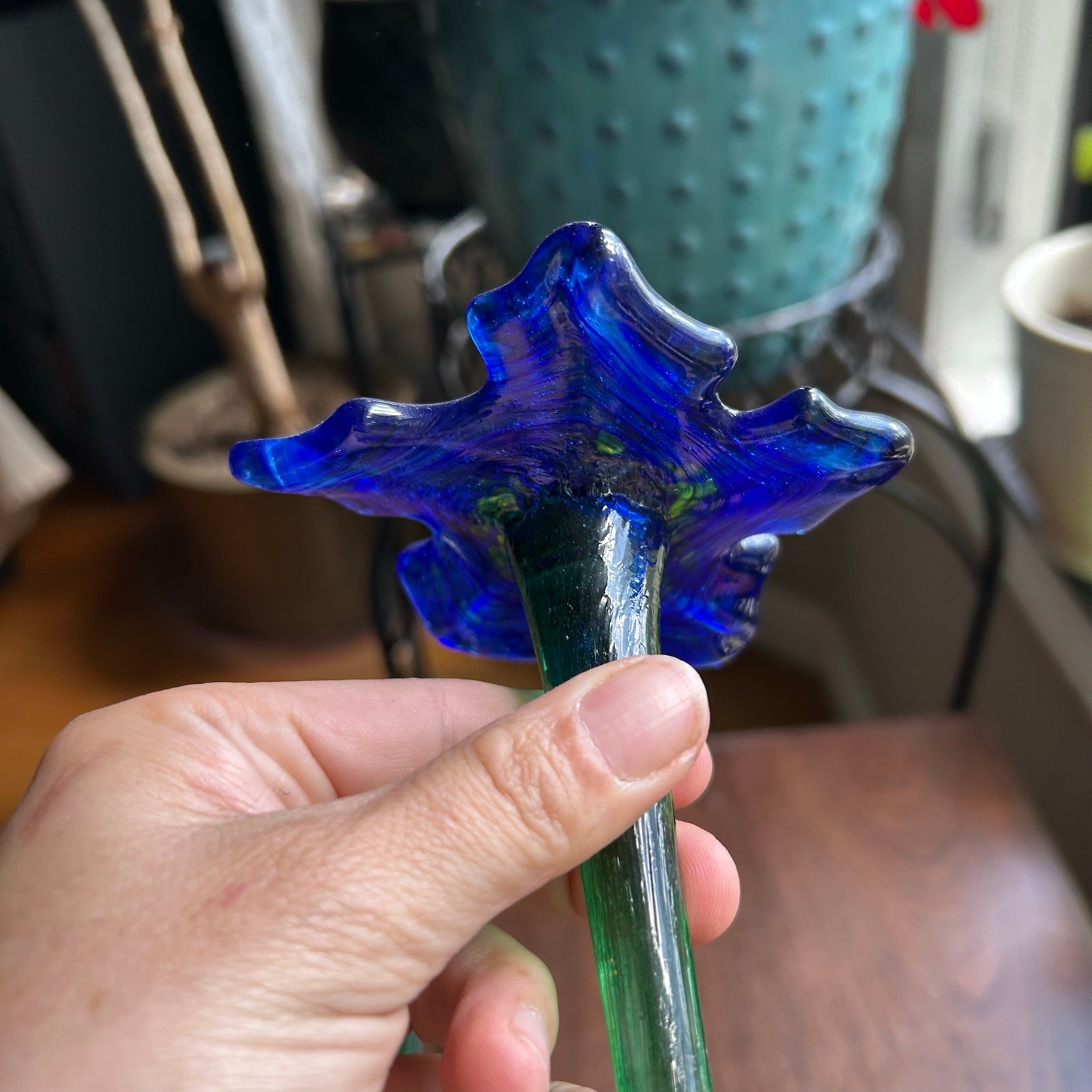 Handcrafted blue and yellow glass flower sculptures long green stems