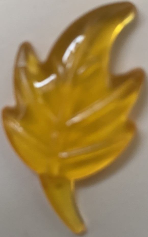 Bag of plastic leaves to scatter for Autumn decoration. Green,red,gold & violet 