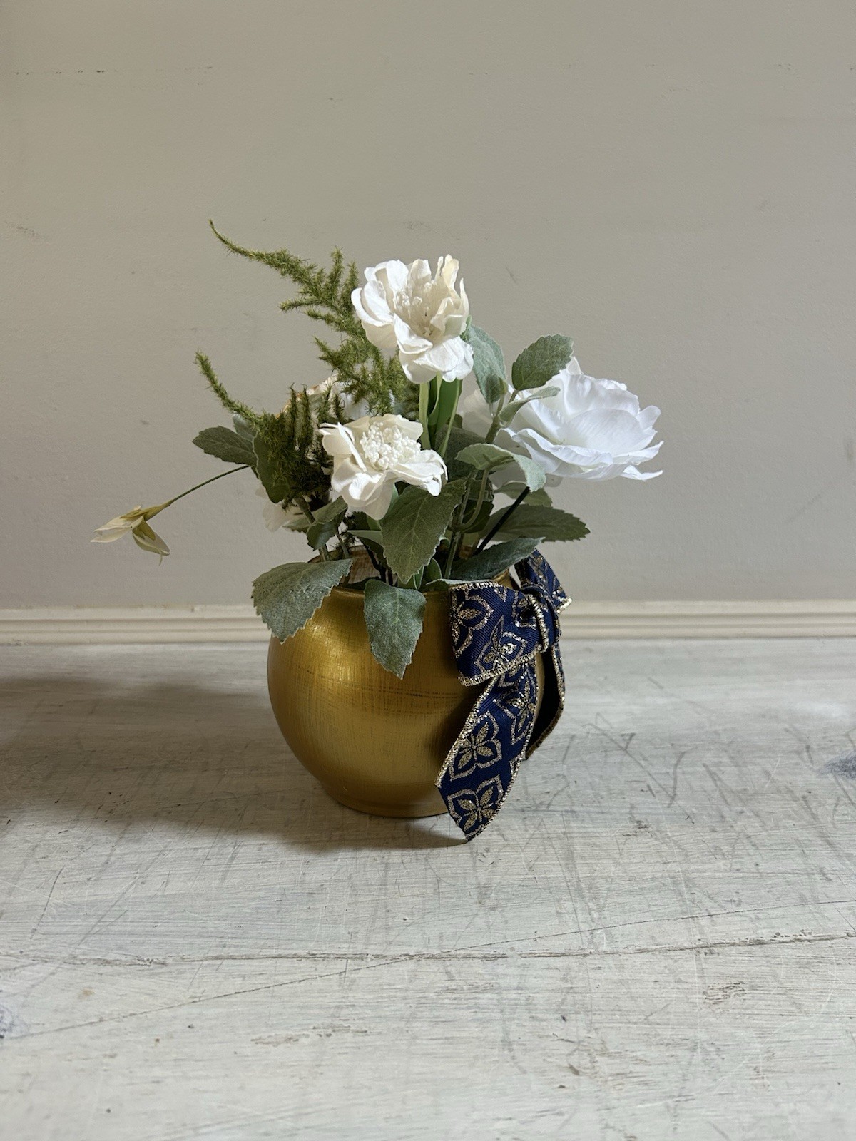 Sage Green White And Gold Floral Arrangement With Navy And Gold Bow