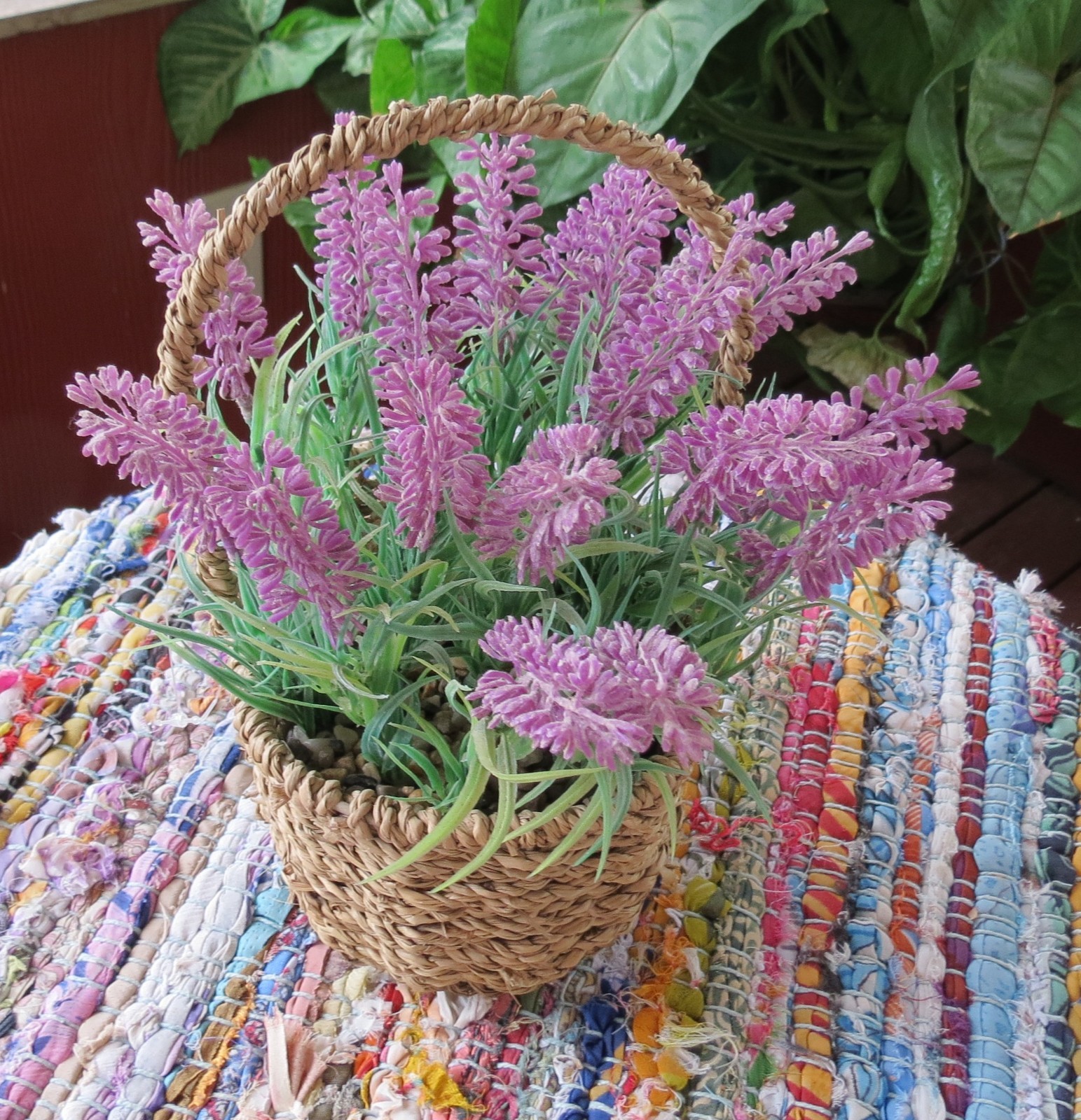 Lavender faux flowers in basket 18 ” around 4″ high 7″ wide