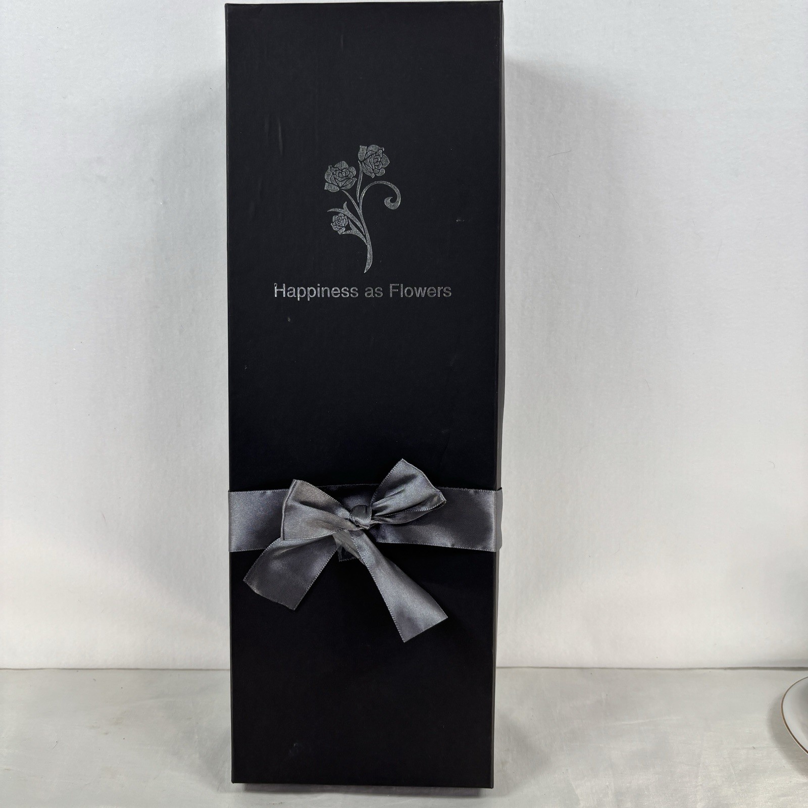Gold-plated artificial rose bouquet in a black gift box