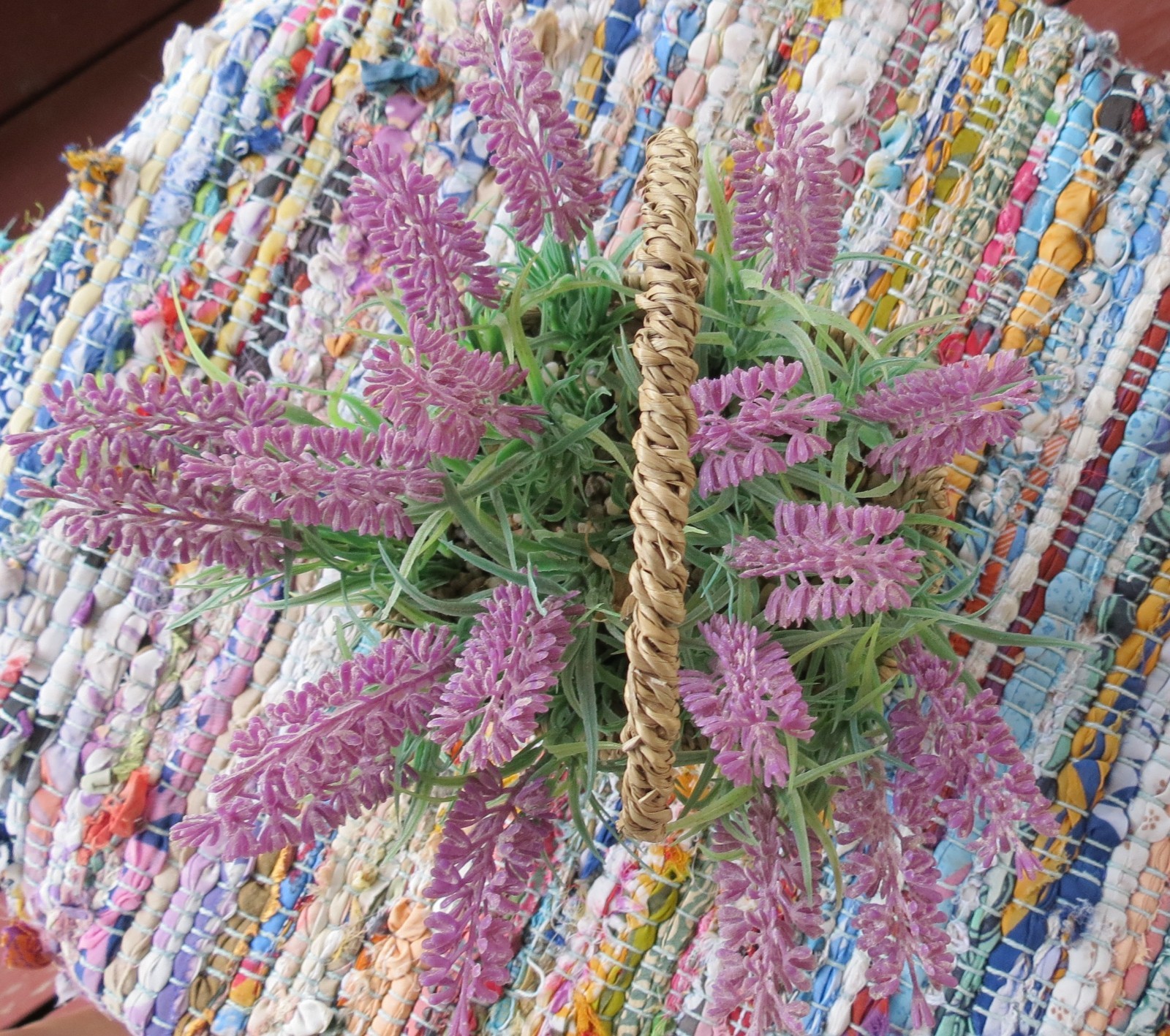Lavender faux flowers in basket 18 ” around 4″ high 7″ wide