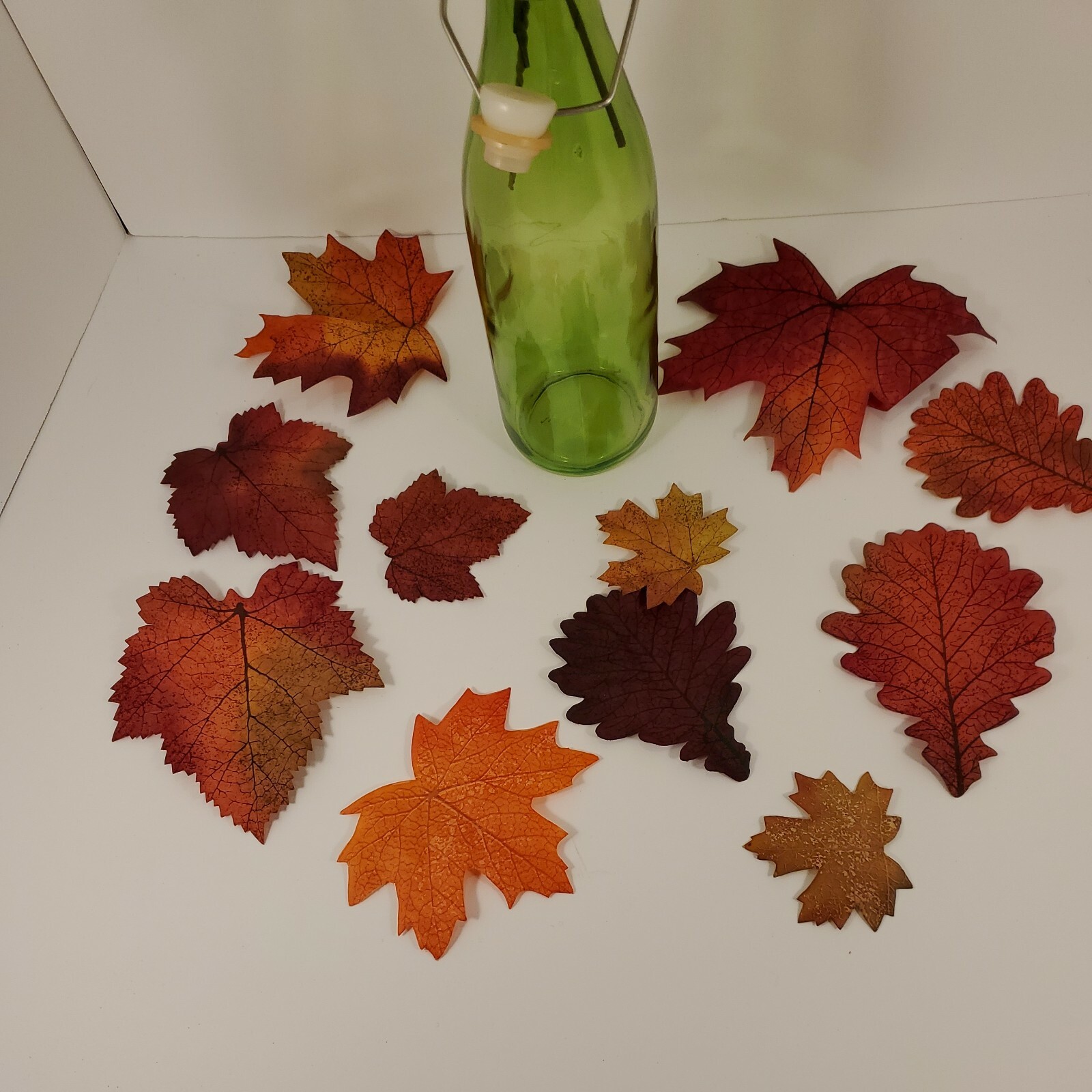 Fall Floral In Green Seal Cap Bottle with Leaves Arrangement Centerpiece