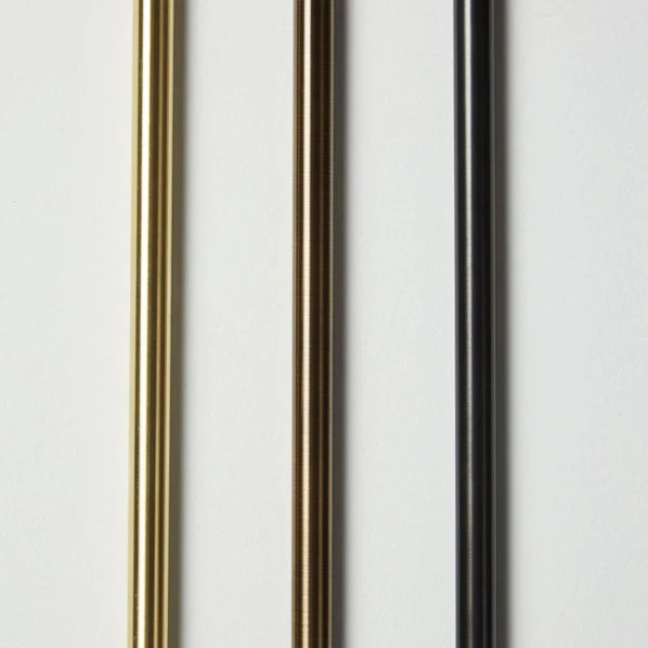 The Double Linear Sconce is solid brass and features an optional leather wrap, h