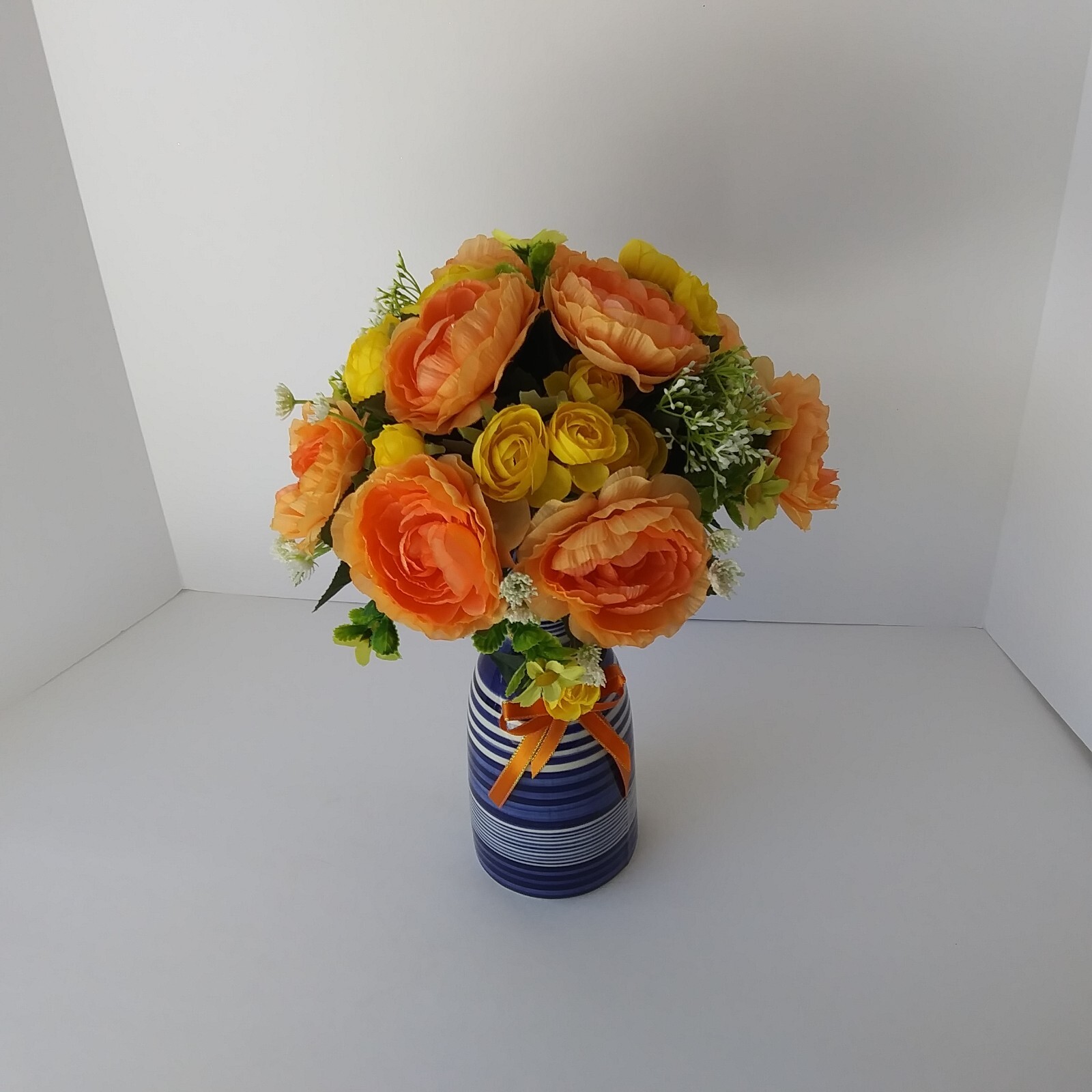 Blue White Striped Pottery Vase with Peach and Yellow Rose Floral Arrangement