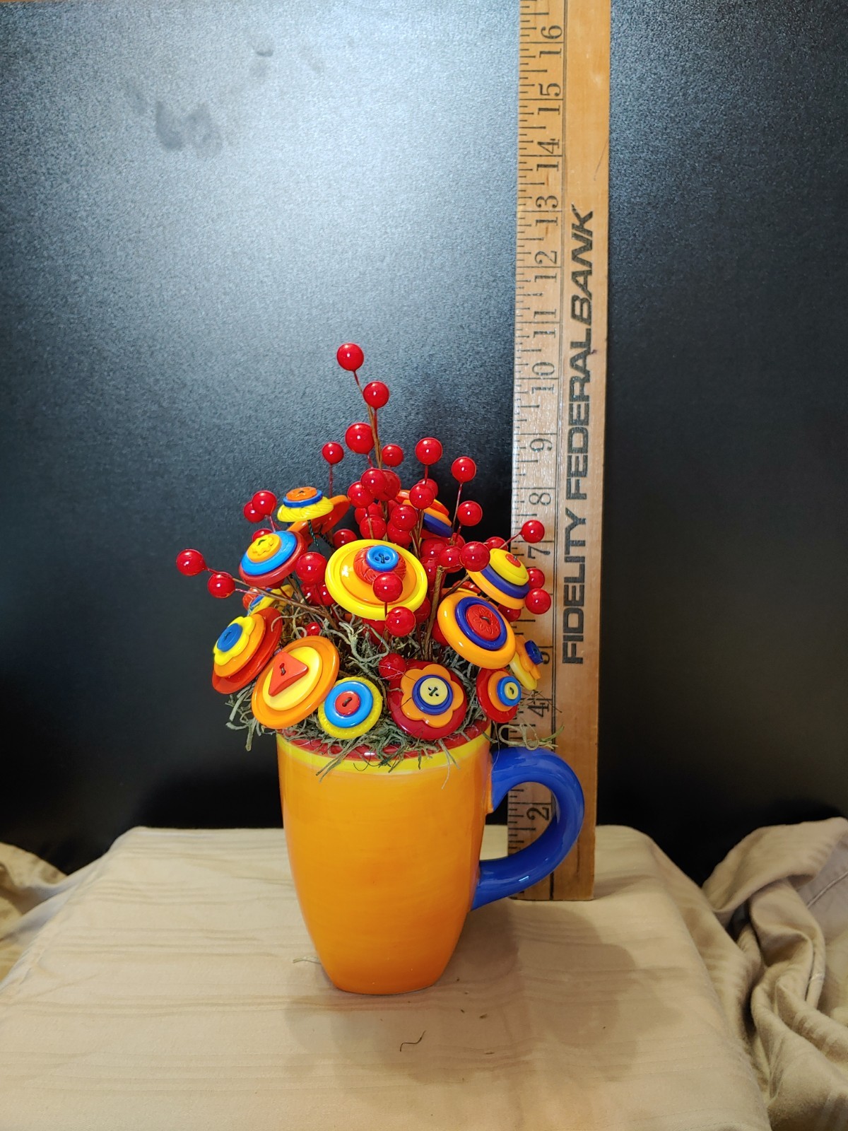 Bright Button Bouquet in Orange Coffee Mug. Red, orange, yellow. fun and playful