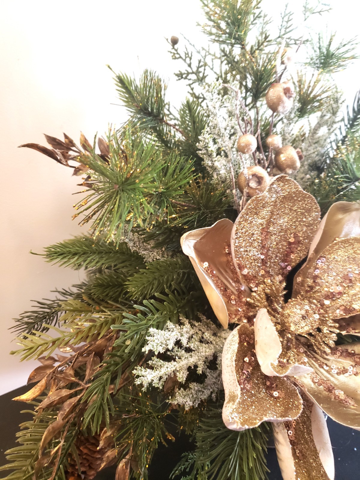 Gold magnolia Christmas floral arrangement, holiday floral arrangement