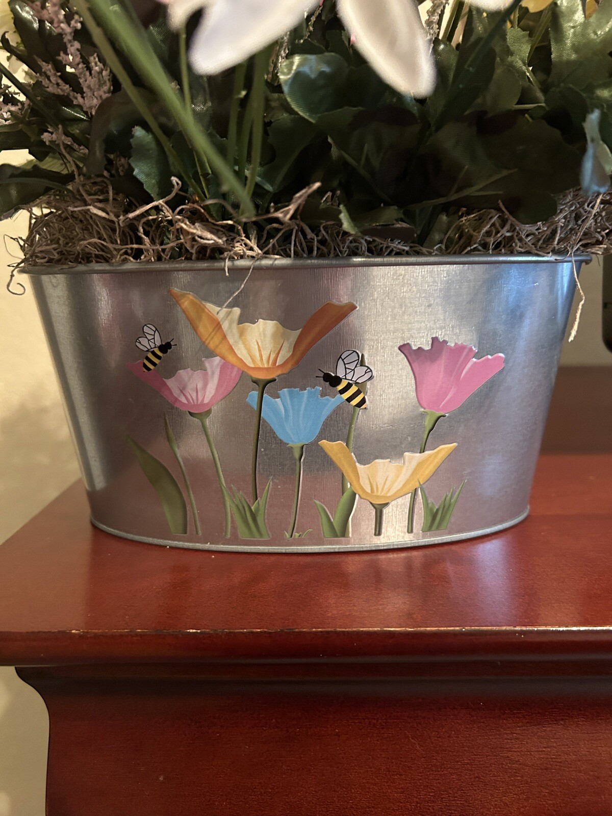 Spring Flower Arrangement in a Silver Metal Canister with Flower and Bee Motif
