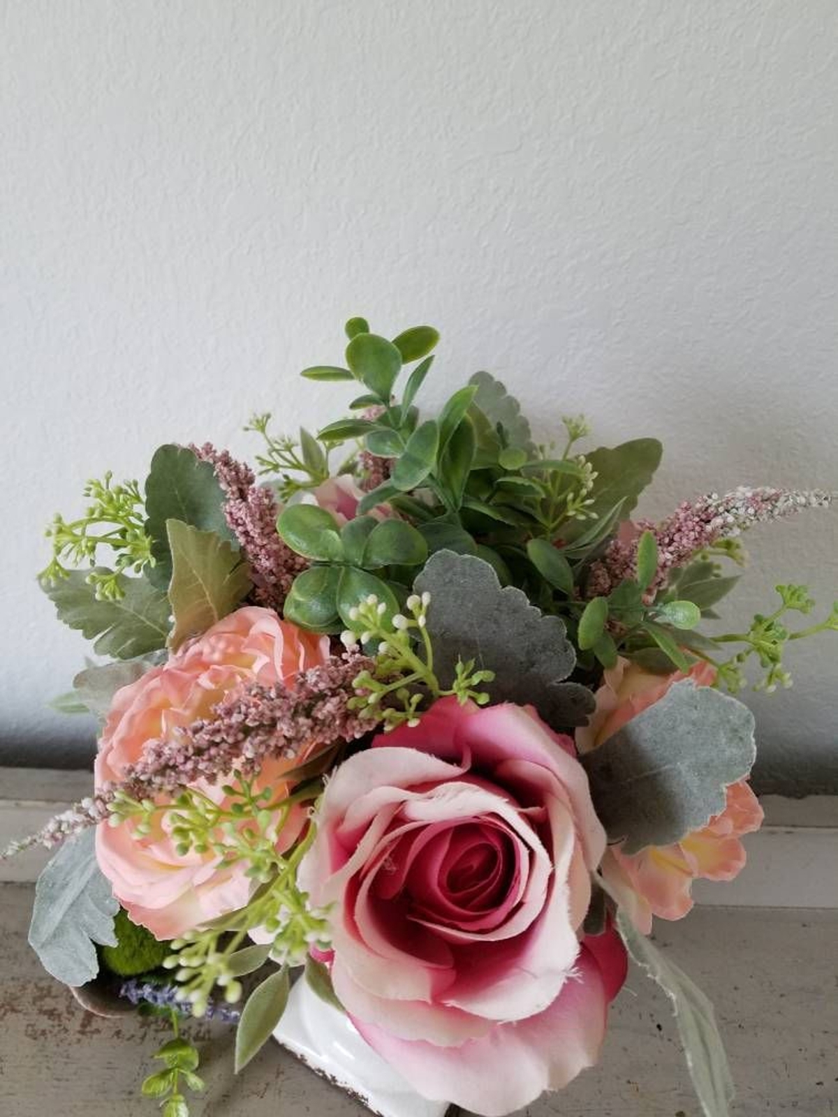 White Urn with faux flowers floral arrangement plants