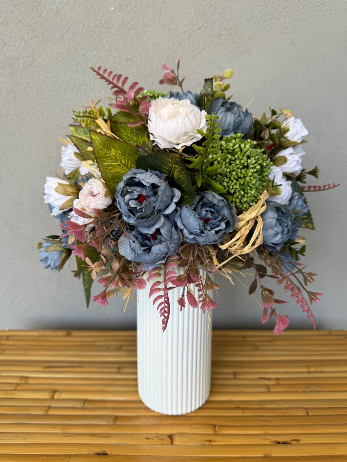 Blue and white flower arrangement in a vase , width 12’, height 15’, home decor.