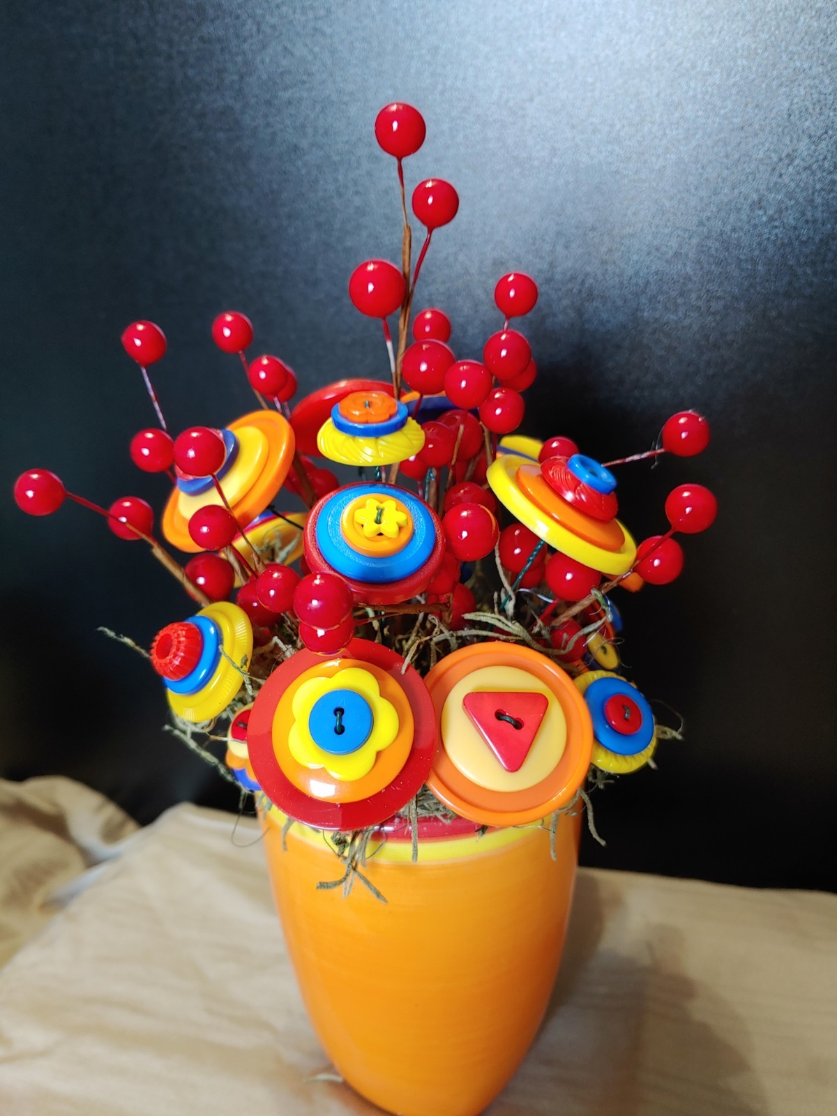 Bright Button Bouquet in Orange Coffee Mug. Red, orange, yellow. fun and playful
