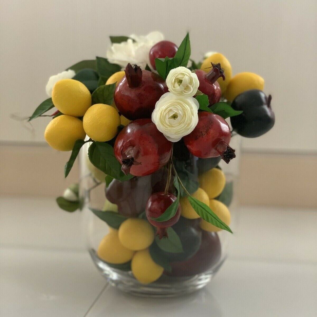 Pomegranate, Lemon, Grapes with Flower Centerpiece Arrangement with Clear Vase 