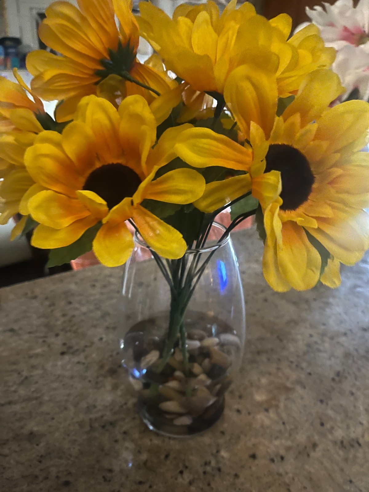 Artifical Sunflowers glass vase faux water and river rocks
