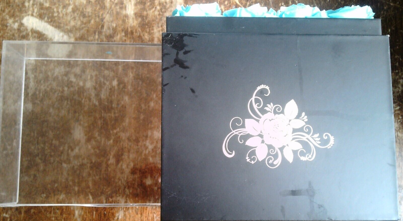16 aqua preserved roses in (approx.) 6.5 x 6.75 x 7.5 inch black box PLEASE READ
