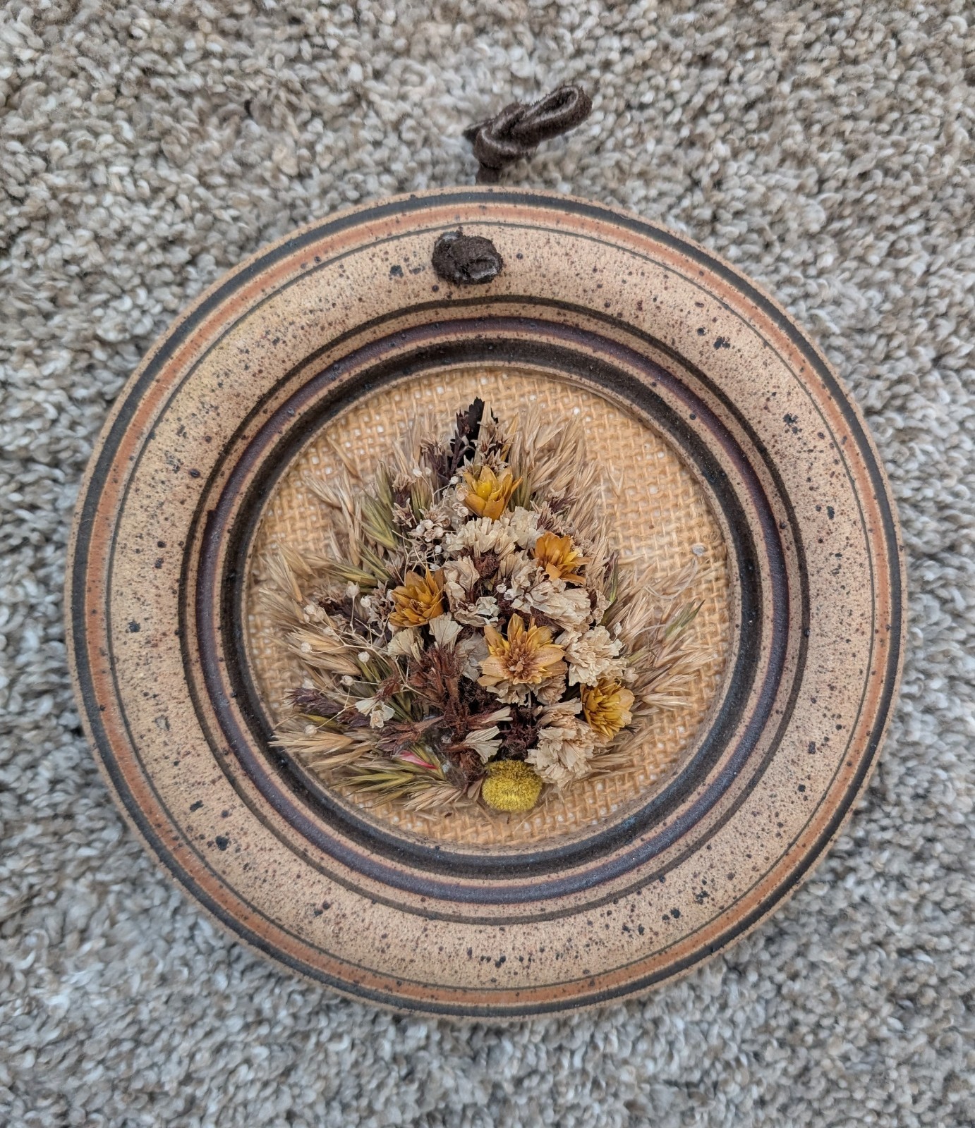 Dried flowers wall hanging round pottery circle speckled floral art boho fall