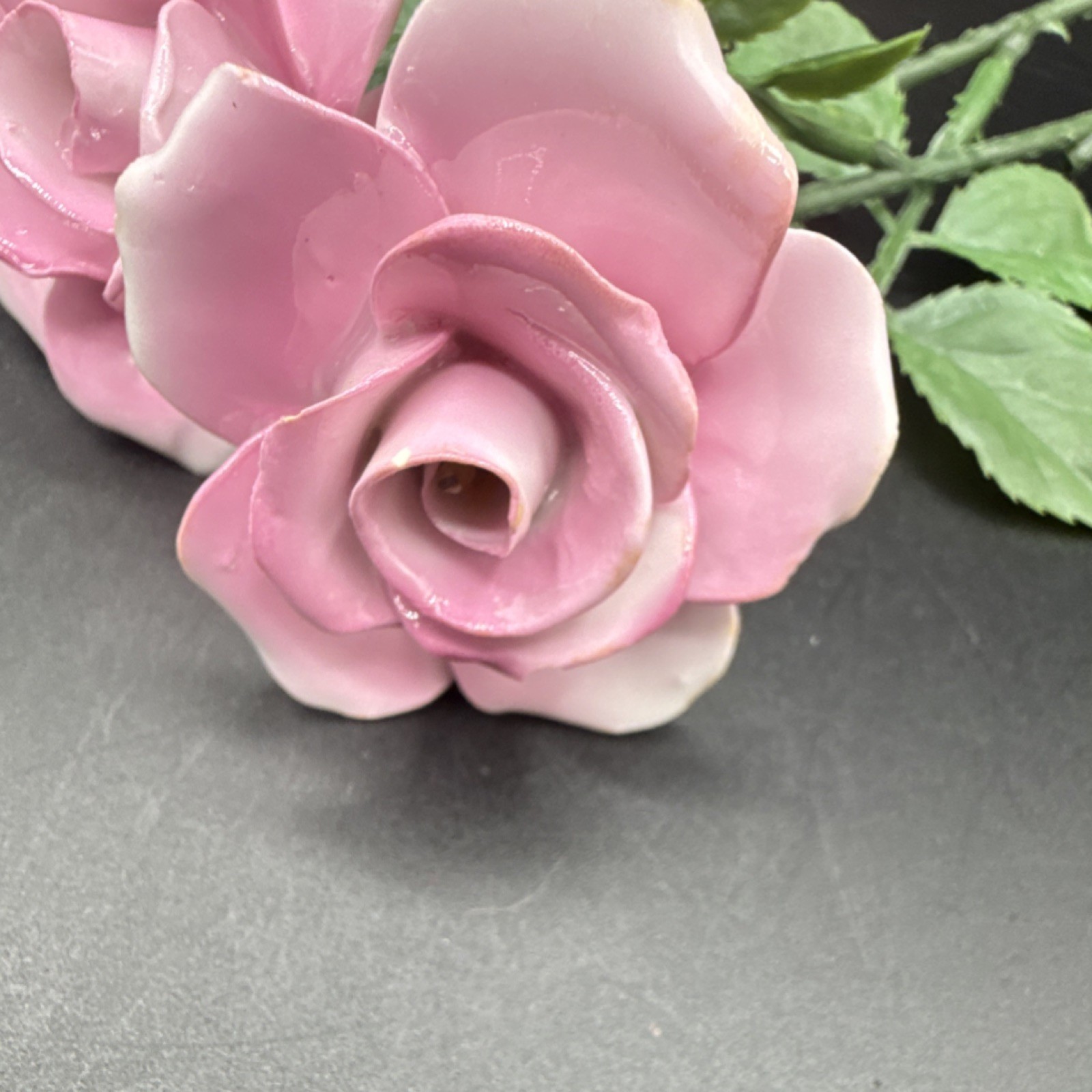 Porcelain flowers, pink roses with plastic stems and leaves