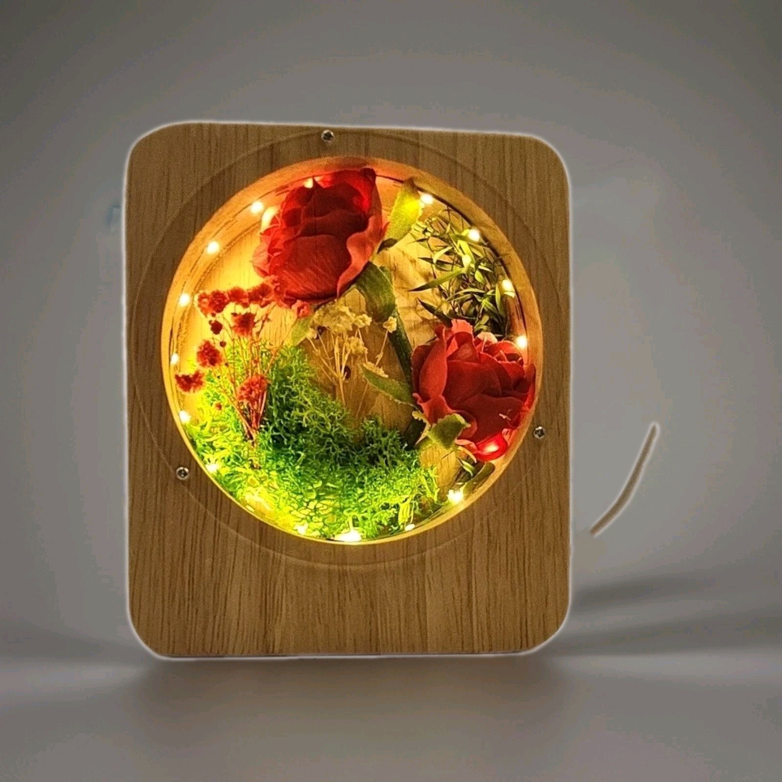 Red Preserved Roses, Green Moss And Small Purple Flowers In Light Up Wooden Box