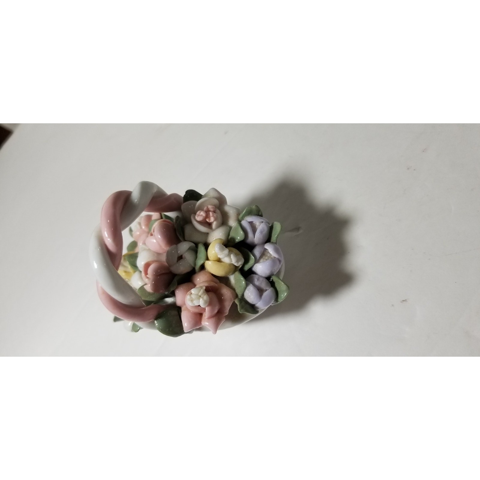 Three inch by 3 inch hand painted porcelain basket (1.1282)