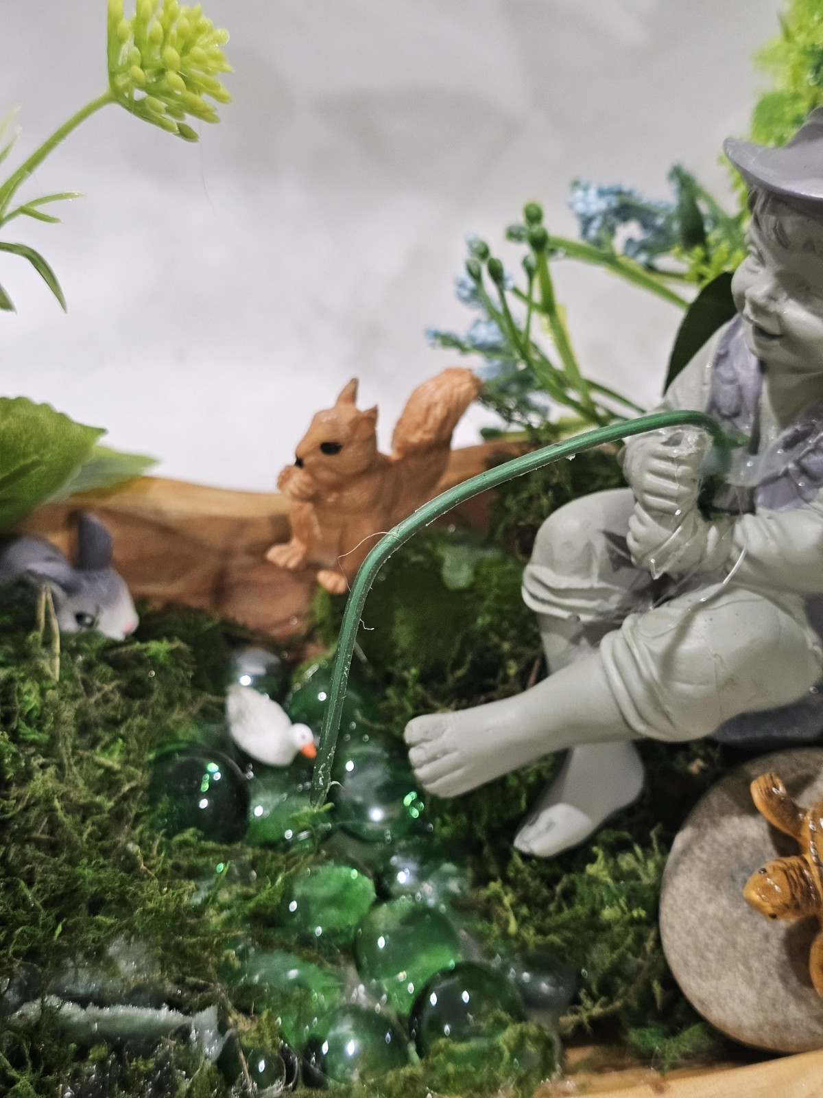 Artifical Flower Arramgement in woods, Boy Fishing Deer, Turtle Duck
