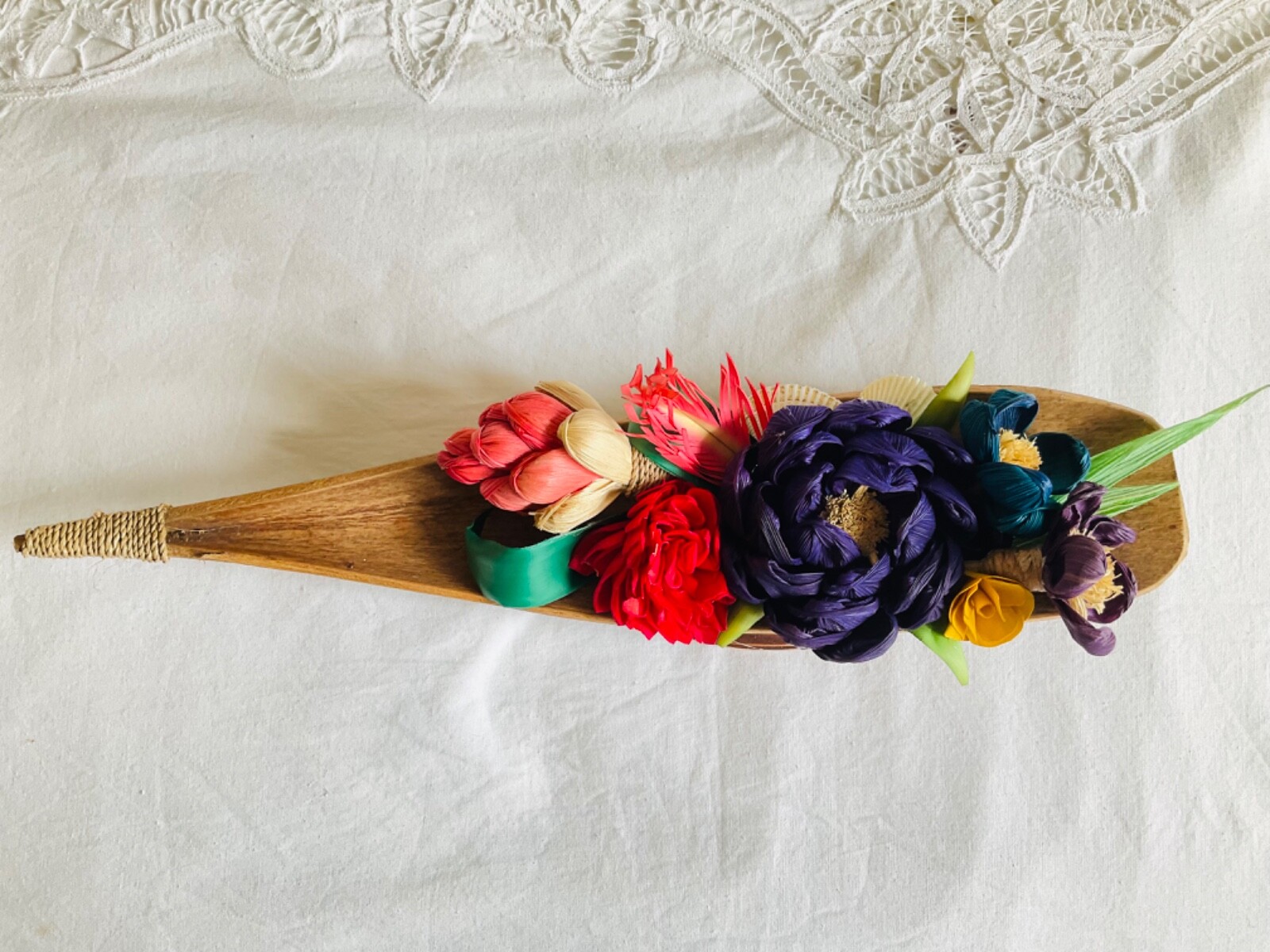 flower arrangements. Coconut spathe vase, dried corn husks, naturals.