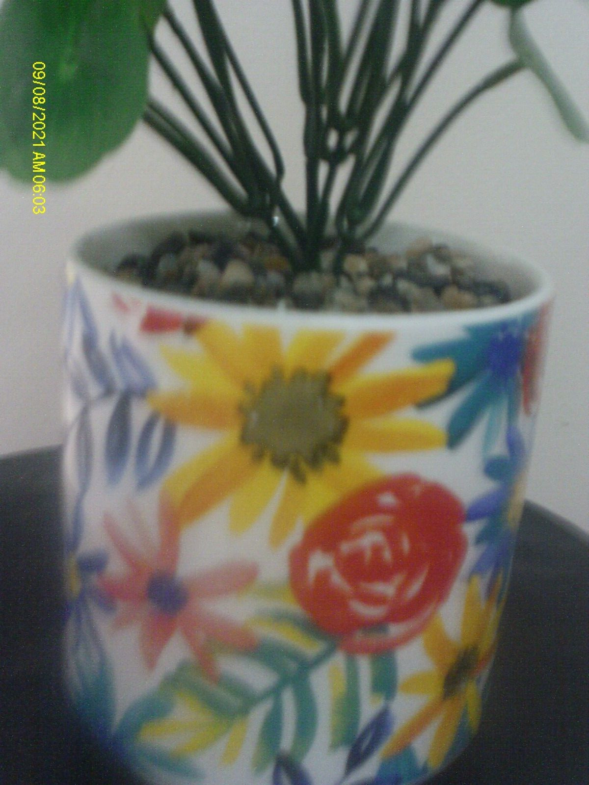 Faux Plant In Ceramic Floral Pot With Stones