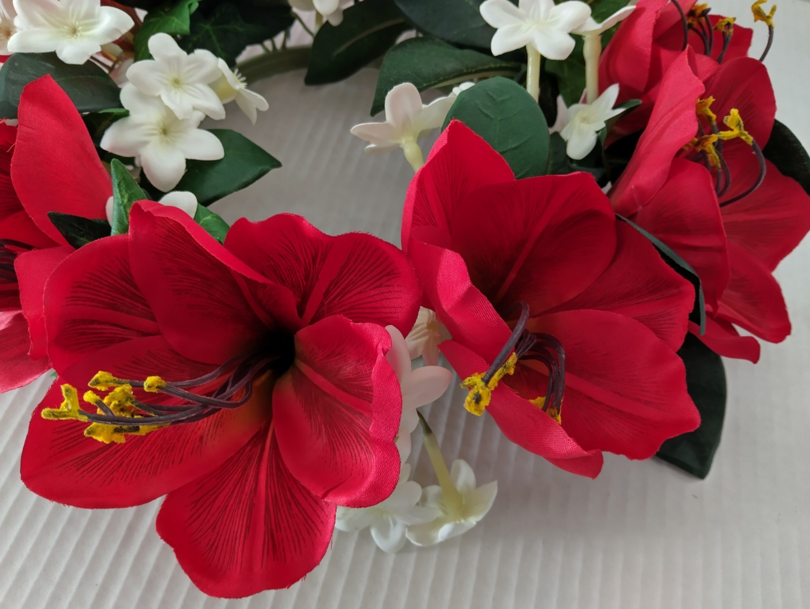 Bright red Amaryllis candle ring for a 6″ pillar candle or cremation urn.