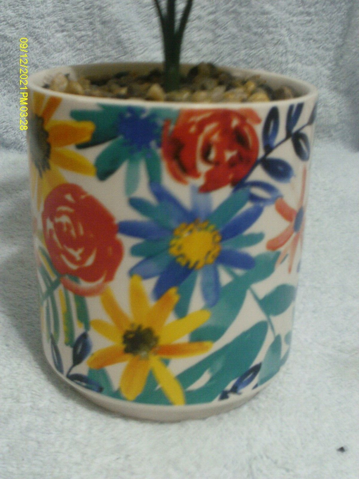 Faux Plant In Ceramic Floral Pot With Stones