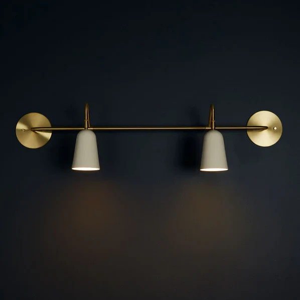 The Perry Double Sconce features solid brass hardware and powder coated aluminum