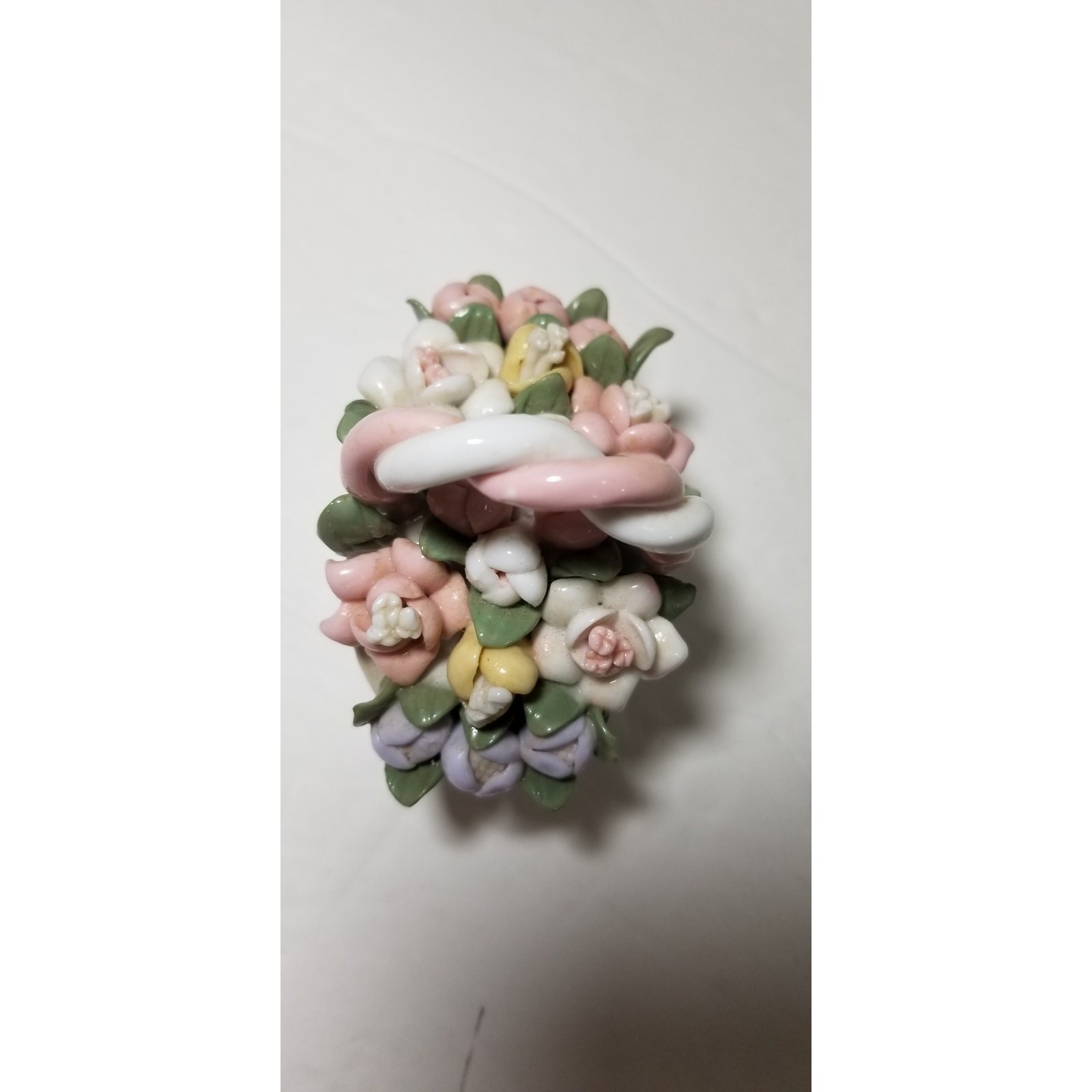 Three inch by 3 inch hand painted porcelain basket (1.1282)