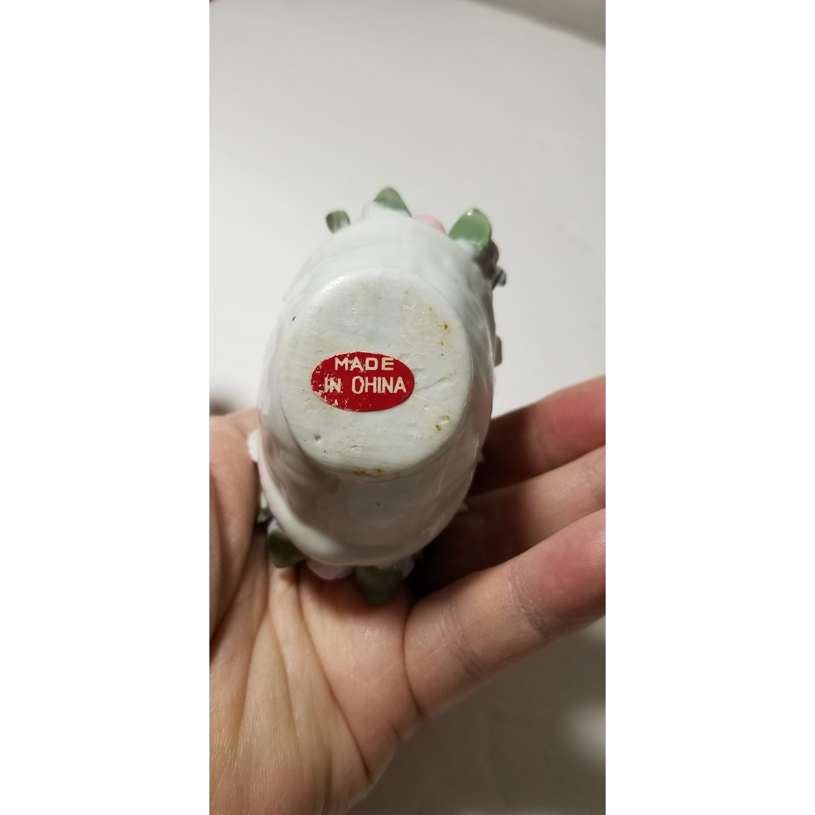 Three inch by 3 inch hand painted porcelain basket (1.1282)