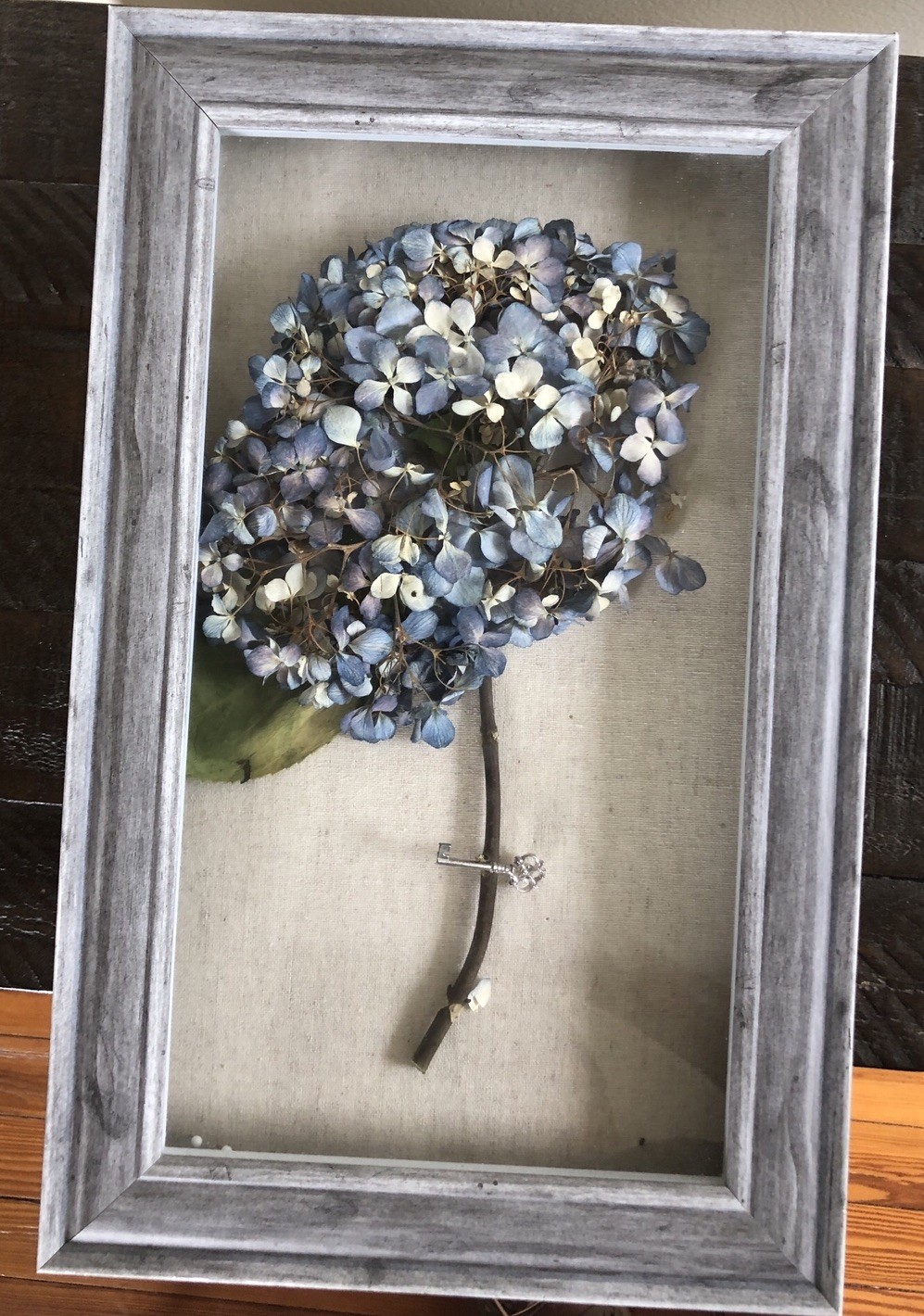 Real dried light blue hydrangea in wood frame 16”H x 10” W