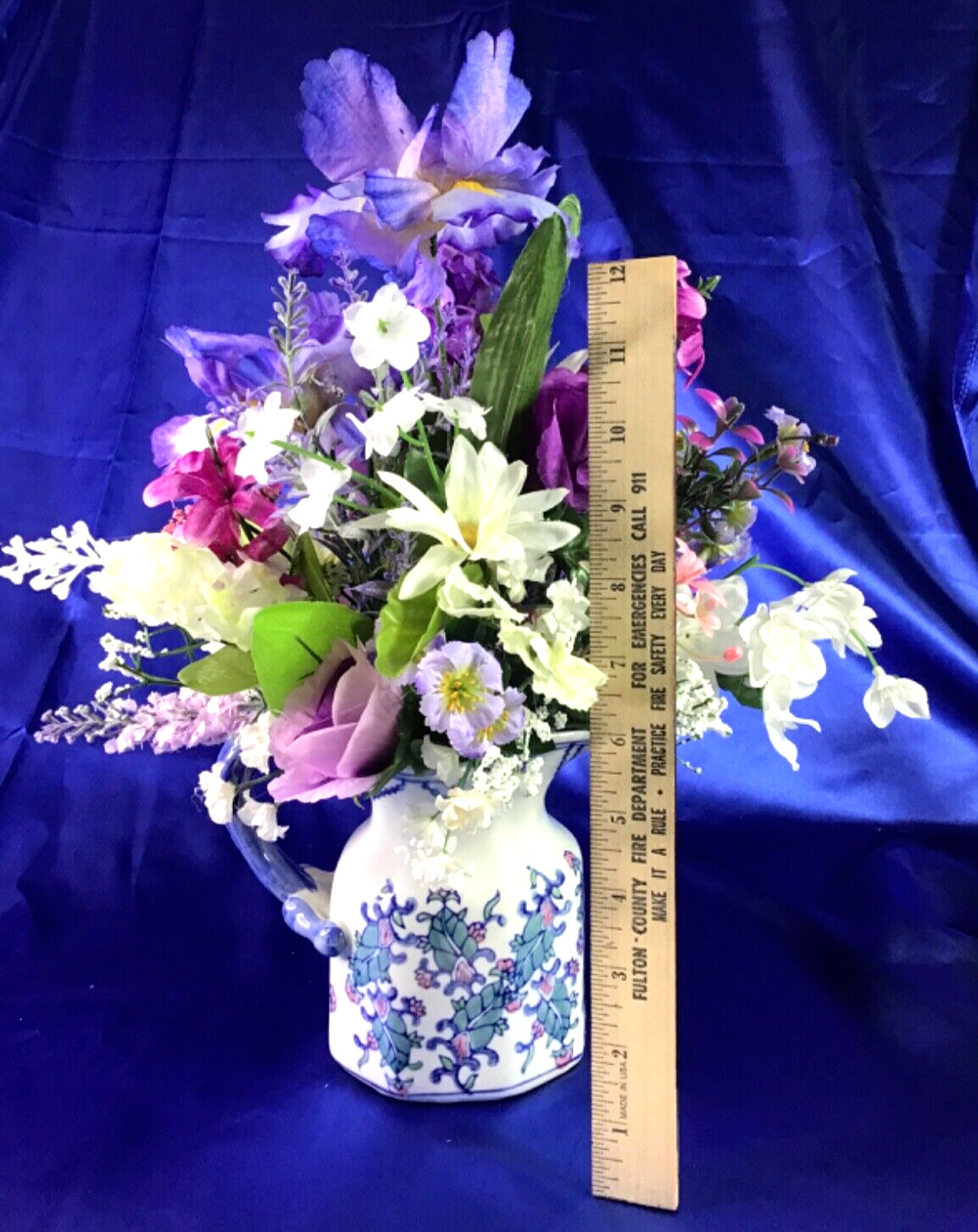 Beautiful Leaf Design Ceramic Pitcher with a Multicolor Floral Arrangement