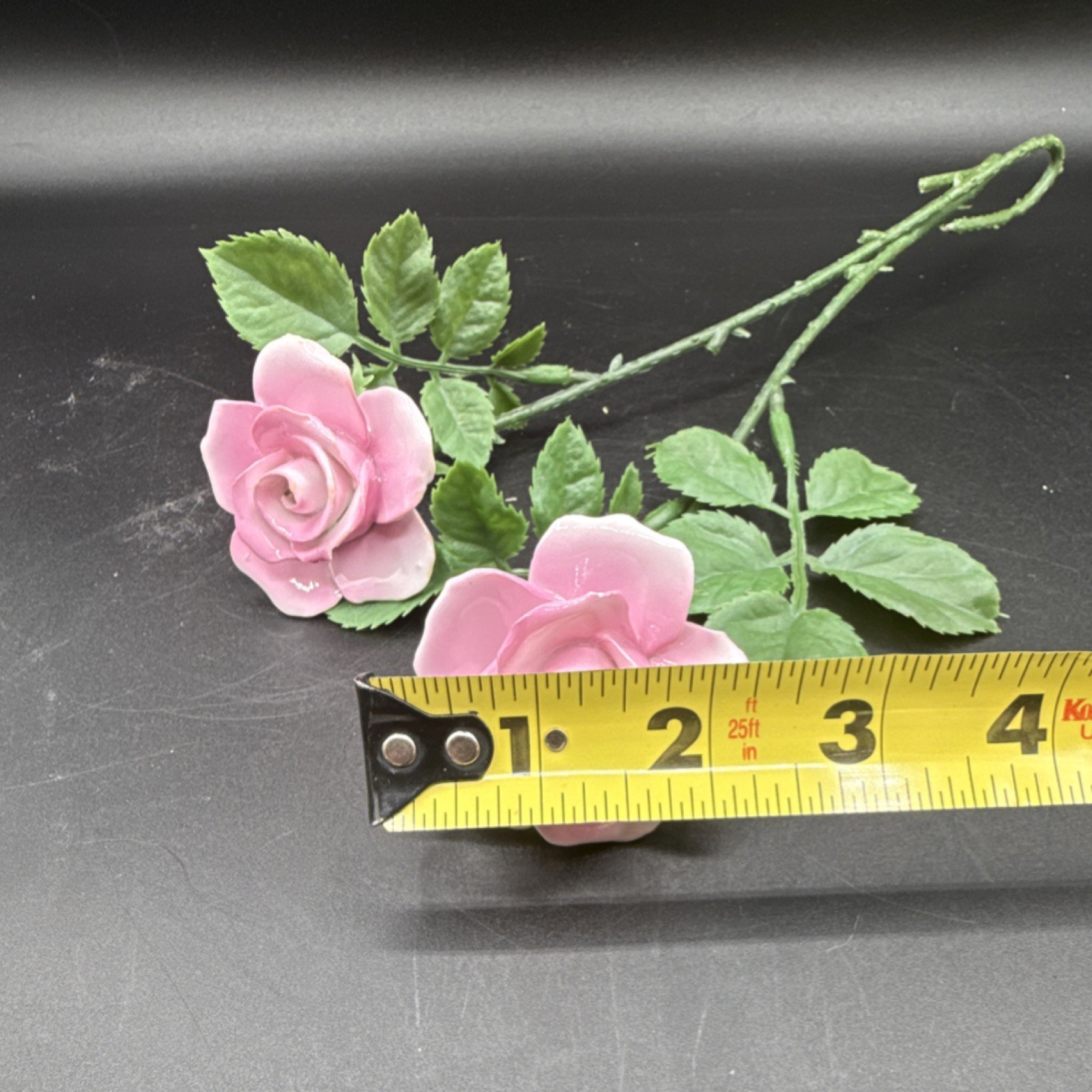 Porcelain flowers, pink roses with plastic stems and leaves