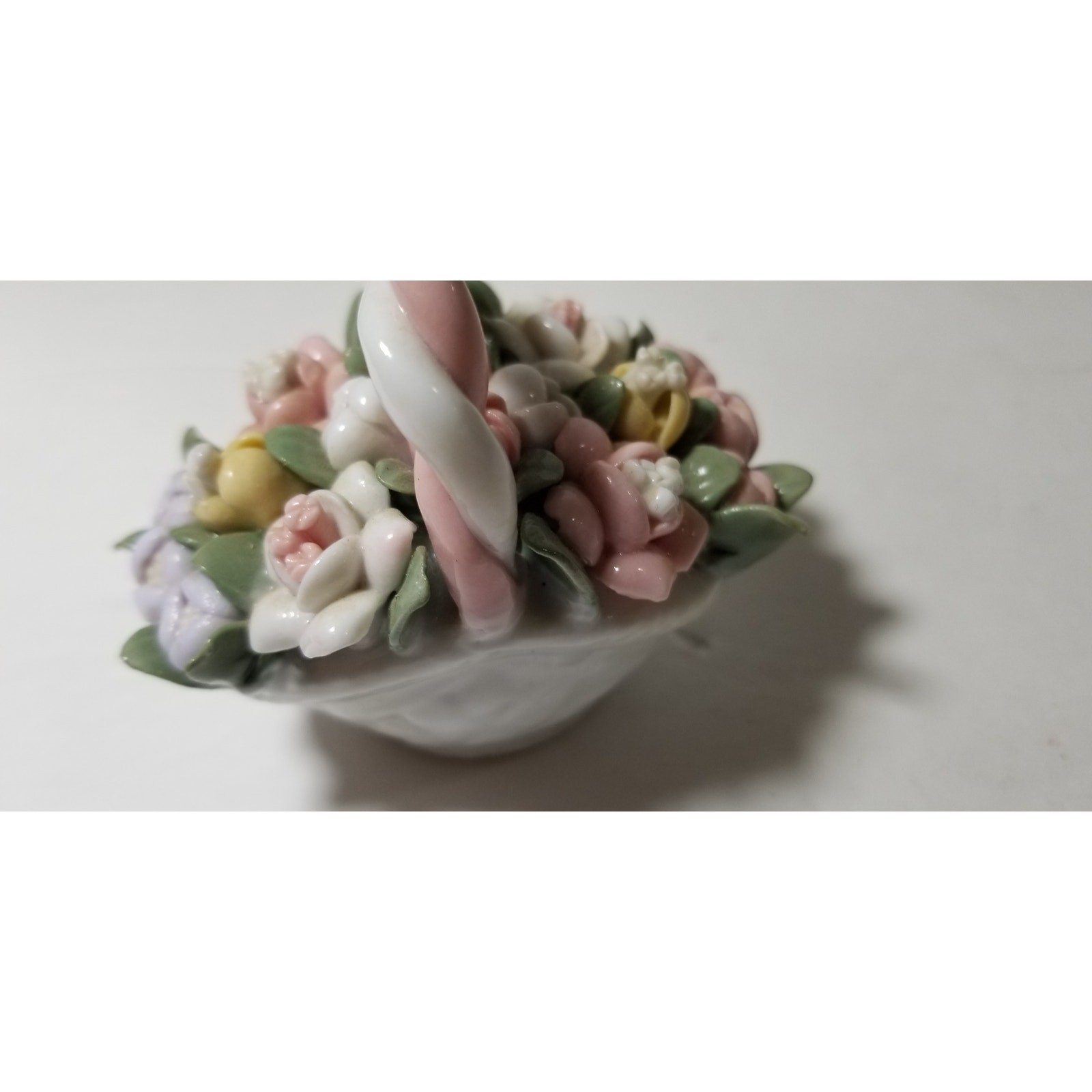 Three inch by 3 inch hand painted porcelain basket (1.1282)