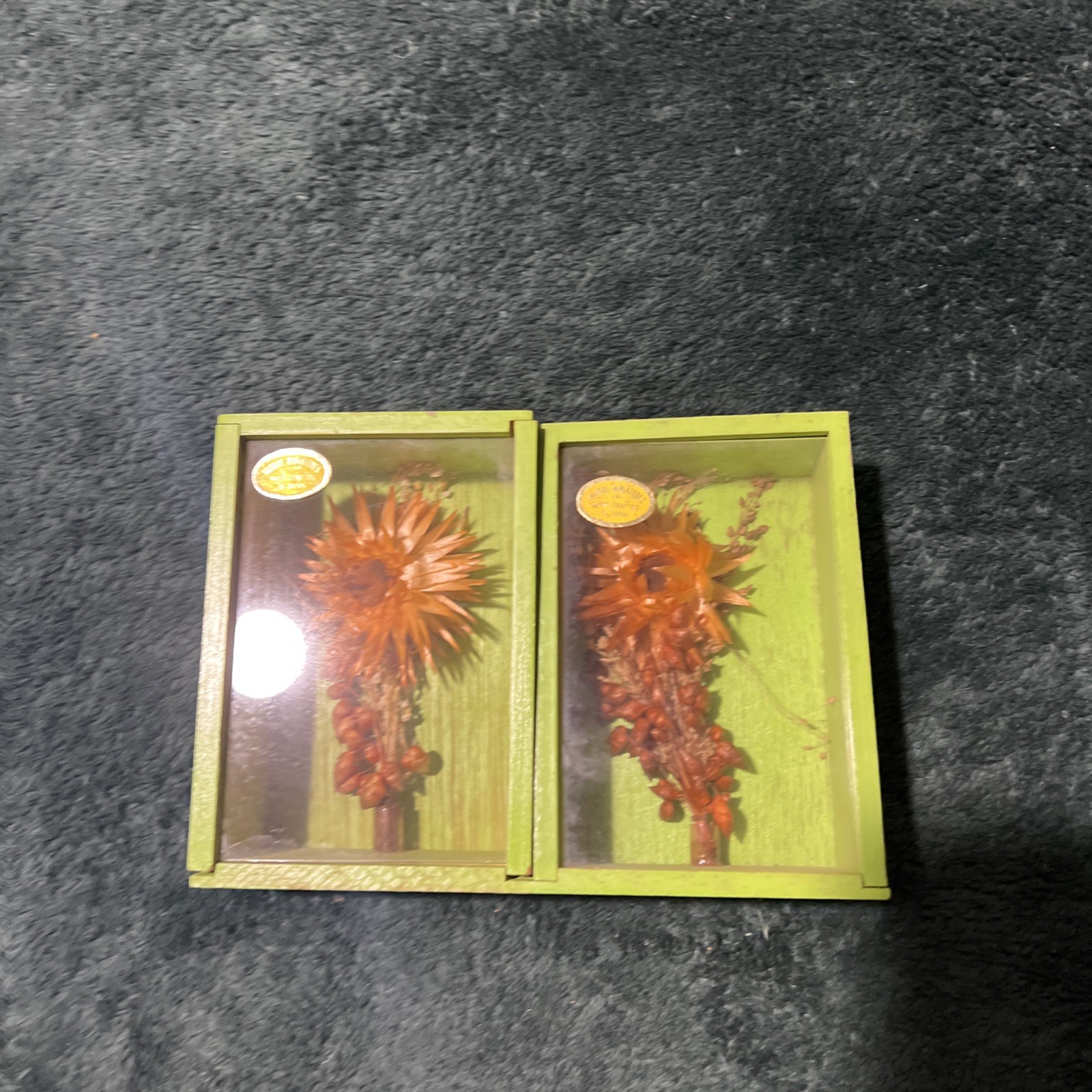 Two Modern Decorative Boxes Containing Dried Orange Flowers and Seed Pods. New