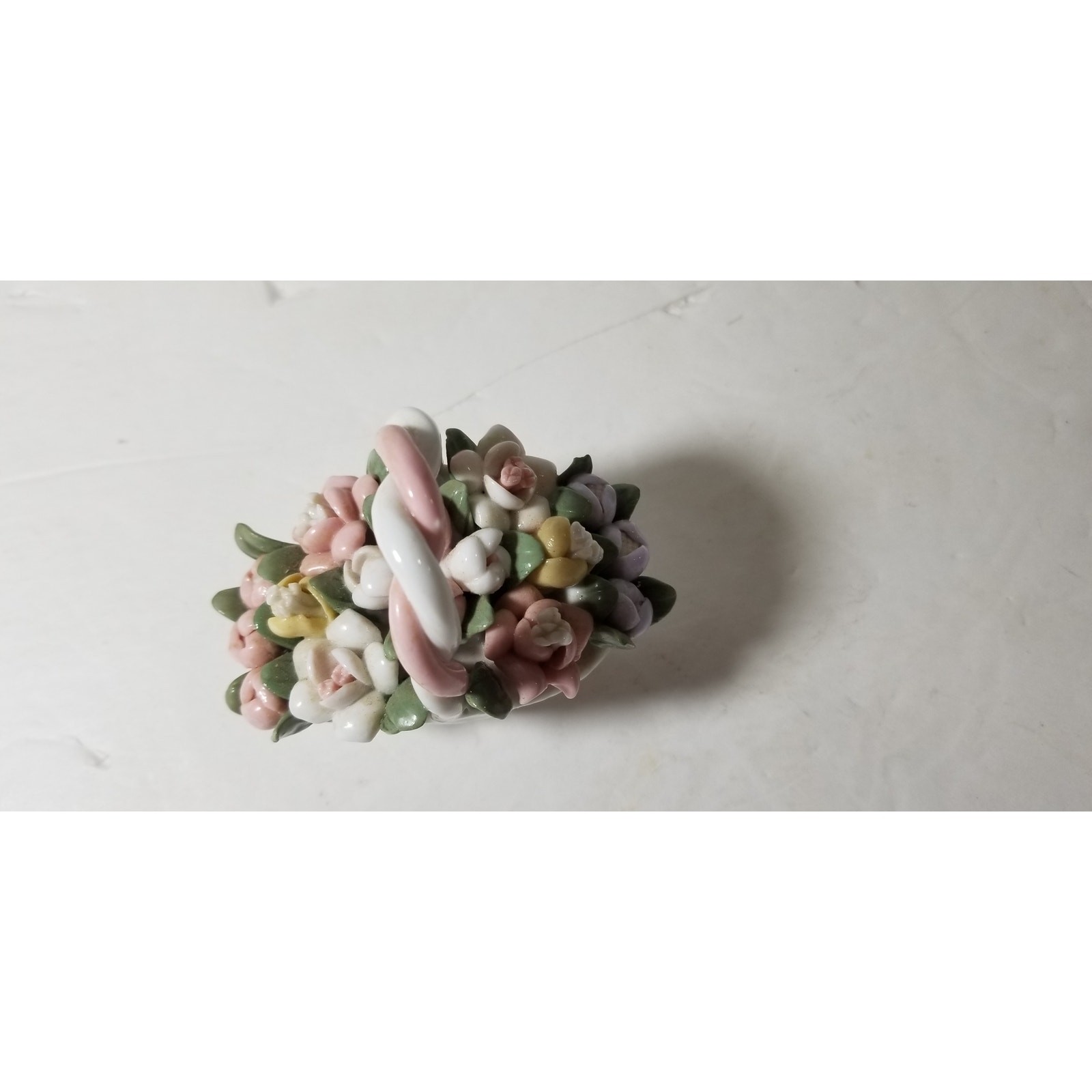 Three inch by 3 inch hand painted porcelain basket (1.1282)