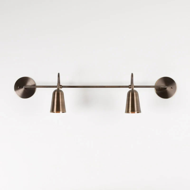 The Perry Double Sconce features solid brass hardware and powder coated aluminum