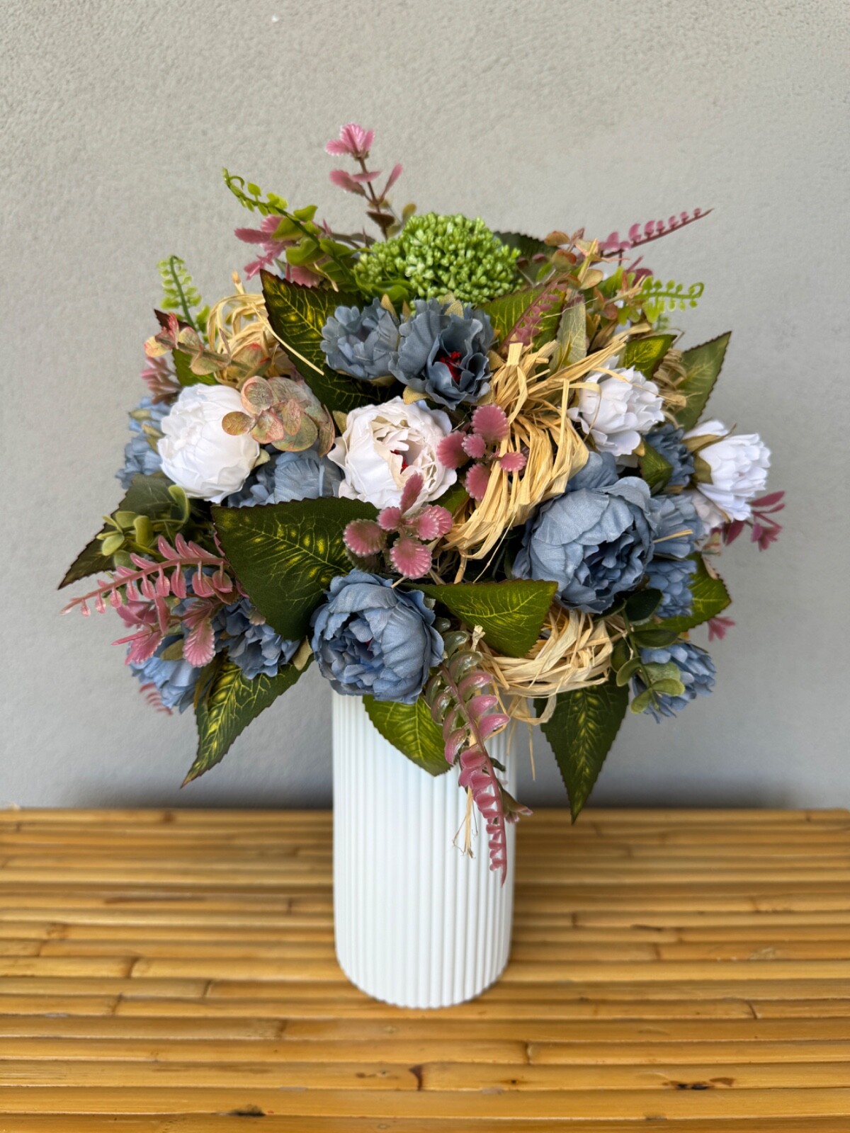 Blue and white flower arrangement in a vase , width 12’, height 15’, home decor.