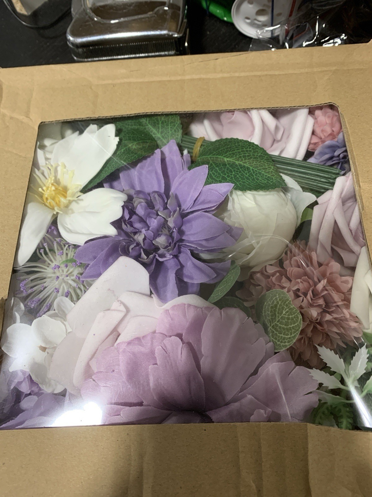 3 boxes of a variety of purple artificial flower heads aprox 3 dozen