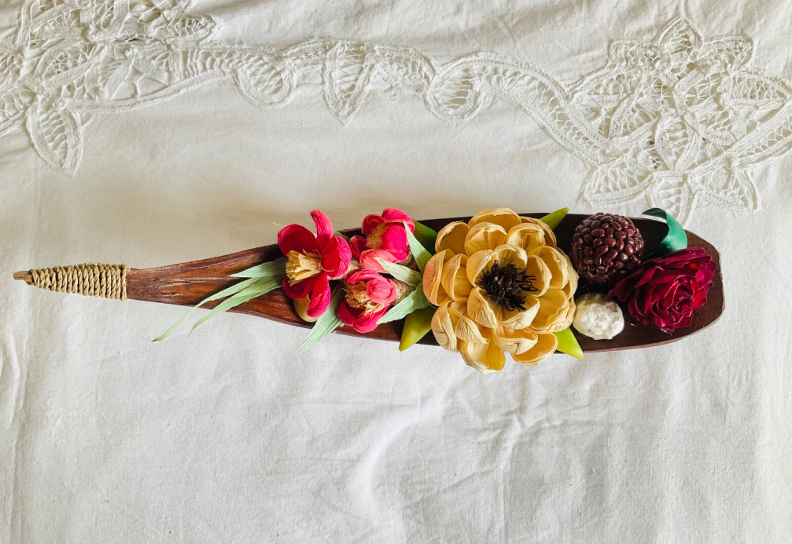flower arrangements. Coconut spathe vase, dried corn husks, naturals.