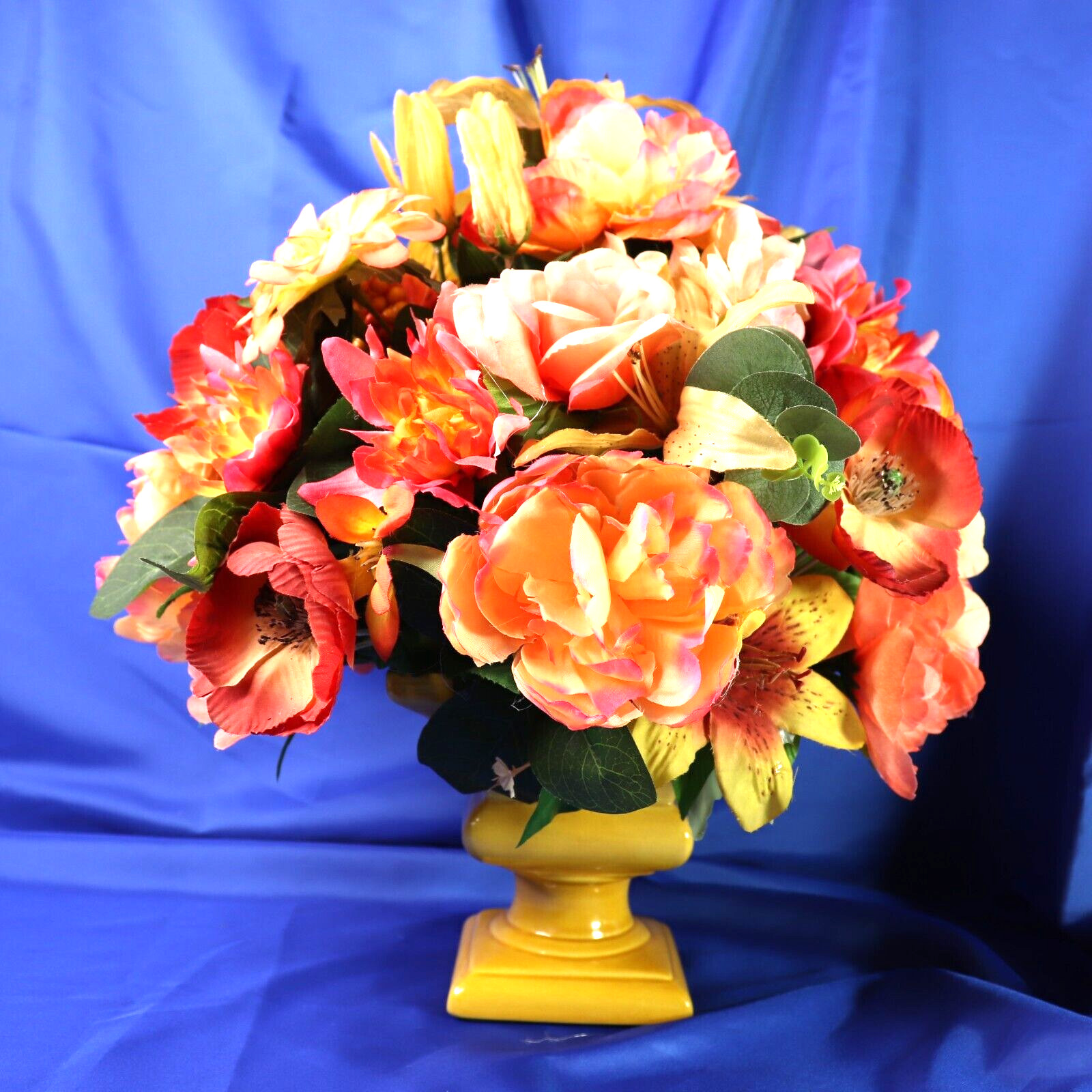 Lovely Floral Arrangement In Shades of Coral Pink & Yellow in a Square Planter