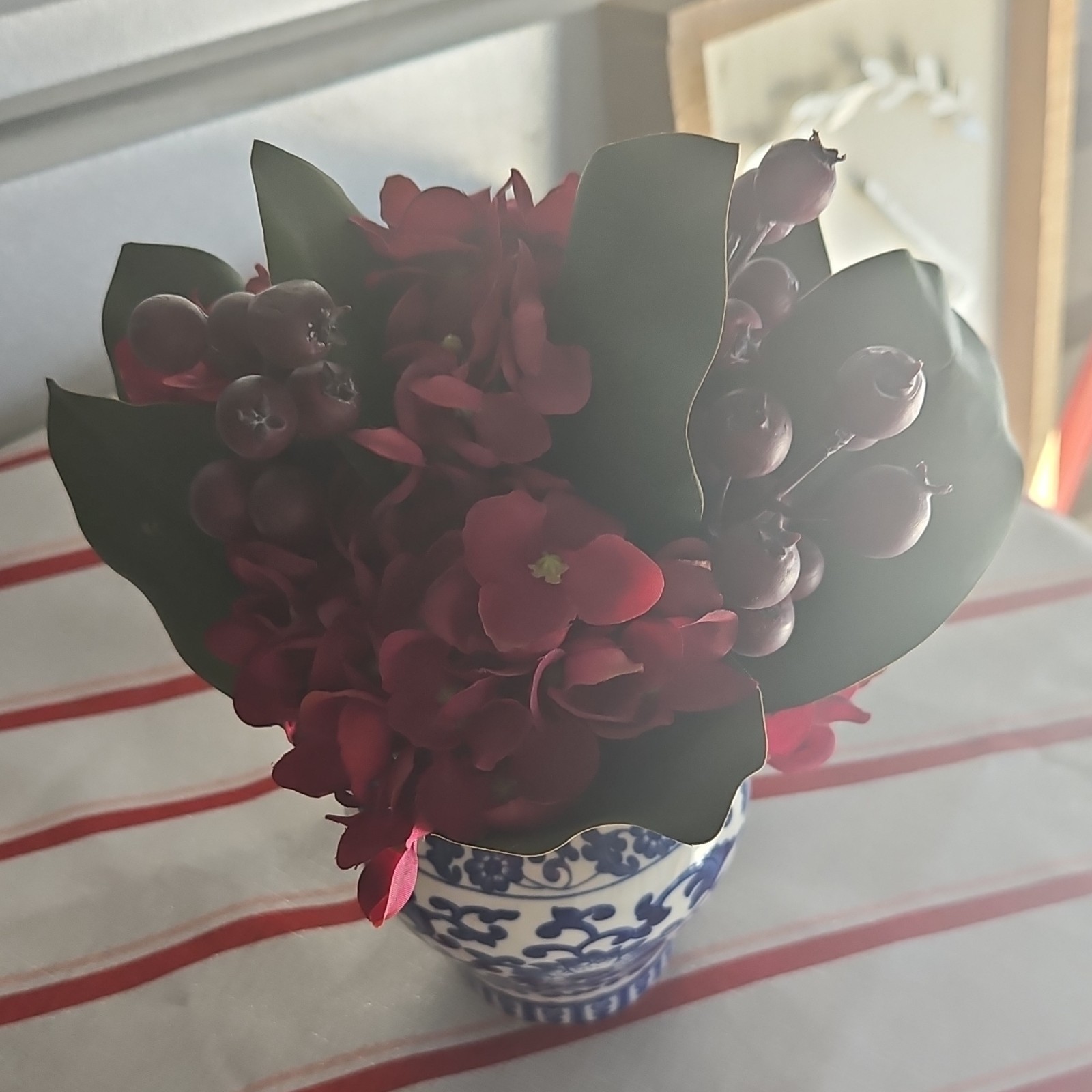 Artificial Red Flower Arrangement with Greenery in Blue and White Vase